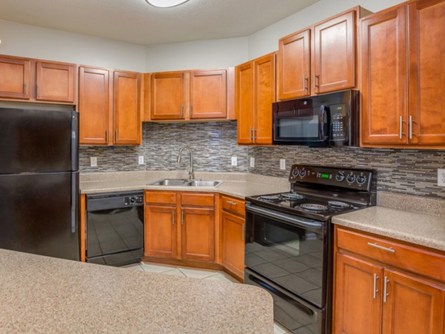 Image of Island Kitchens with Black Appliances for Reserve Bartram Springs (Closed)