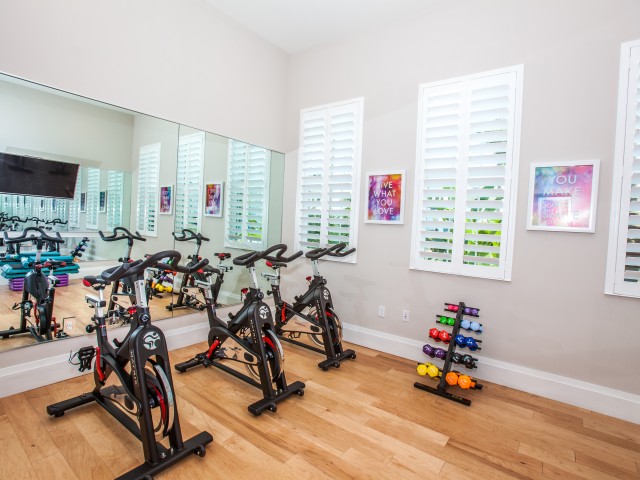 Three spin bikes in Fitness Studio with free weights l High Ridge Landing
