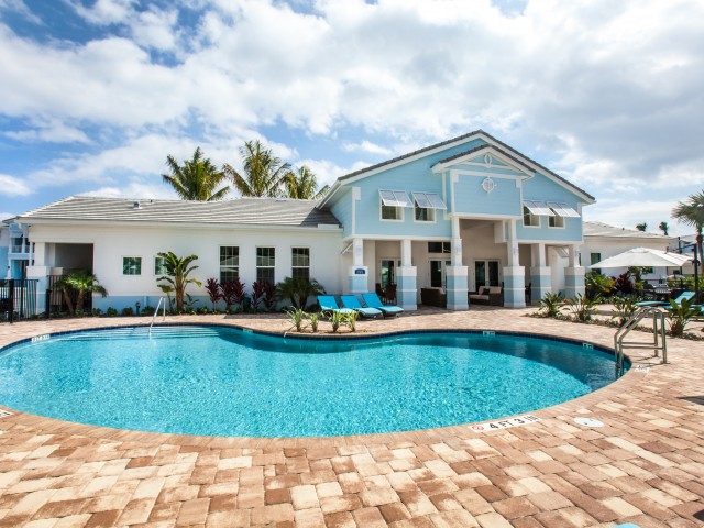 Swimming Pool with large sun deck and three lounge chairs l High Ridge Landing