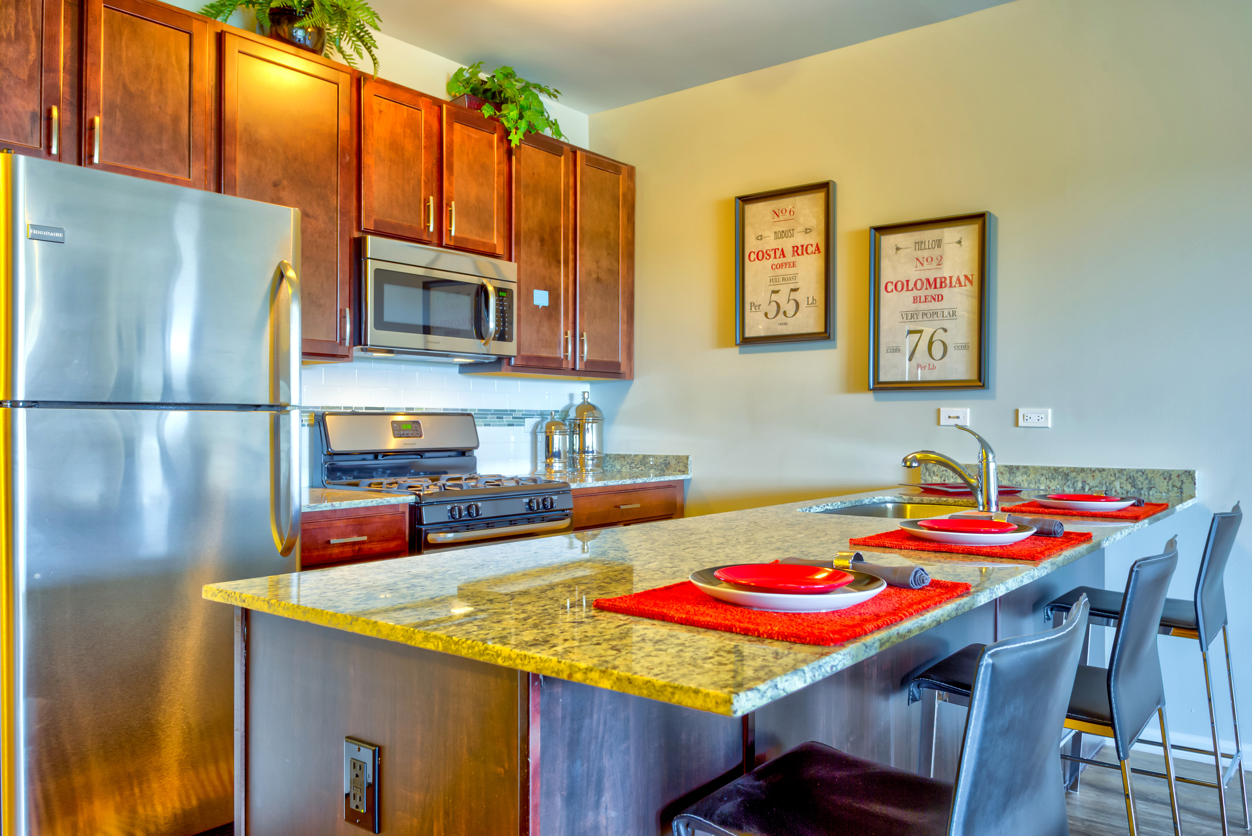 Image of Furniture-quality, 42-inch cabinetry and faux wood floors in living areas for Wheaton 121 Apartments (Closed)