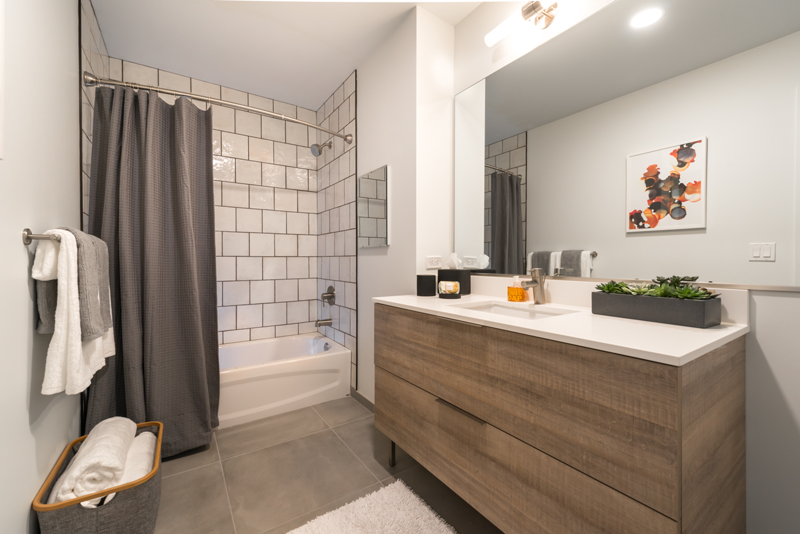 Image of Spa-like bathrooms featuring designer ceramic and porcelain tiles, custom vanities, and 42