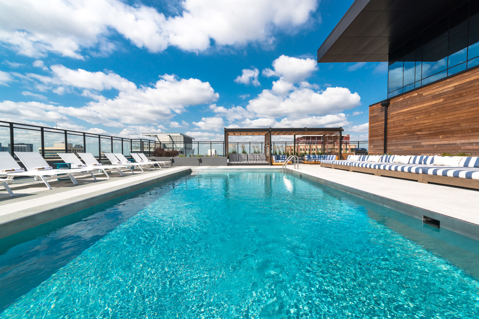 Image of Resort-inspired sundeck featuring an outdoor pool, private cabanas, and outdoor grilling stations with panoramic views of the Chicago skyline for Aurelien (Closed)