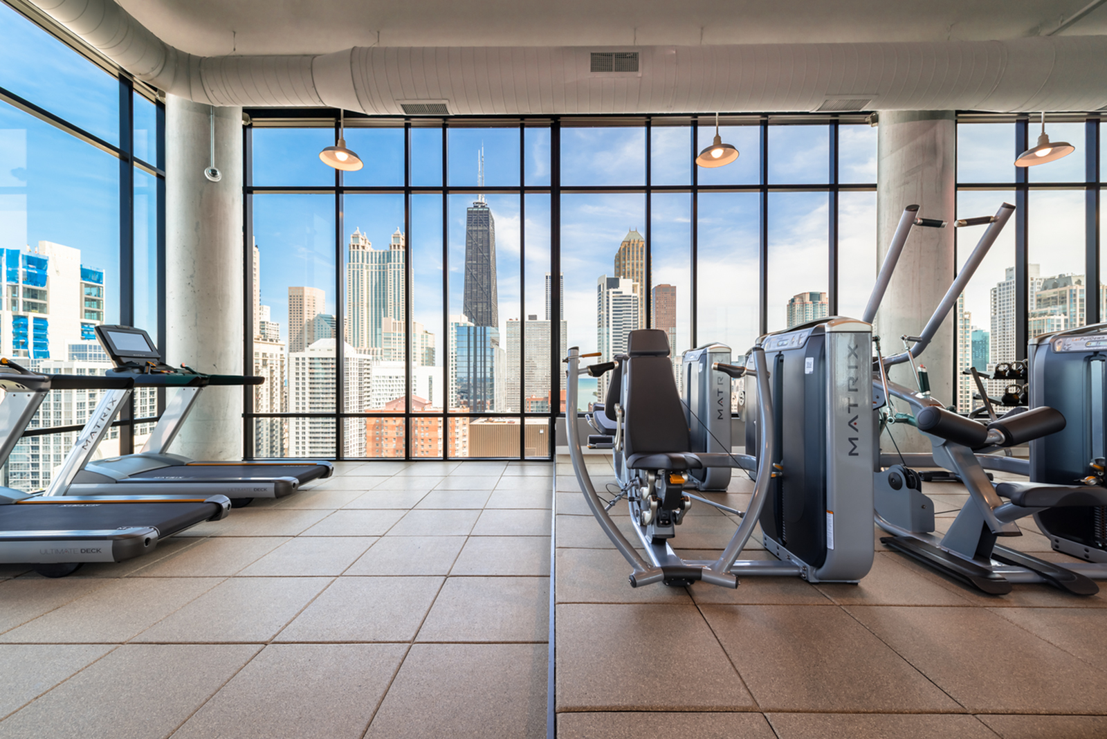 Image of 2,600 square foot health club with expansive health club with Matrix cardio and strength training equipment with individual TV screens for Aurelien (Closed)