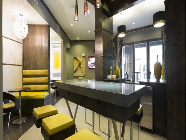 Image of Resident clubhouse with multiple social areas and internet cafÃ© for The Fields Woodlake Square