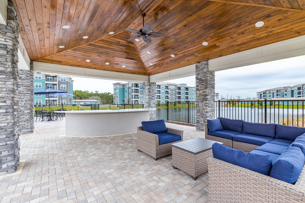 San Mateo Apartments Kissimmee Florida outdoor kitchen with grills and seating area