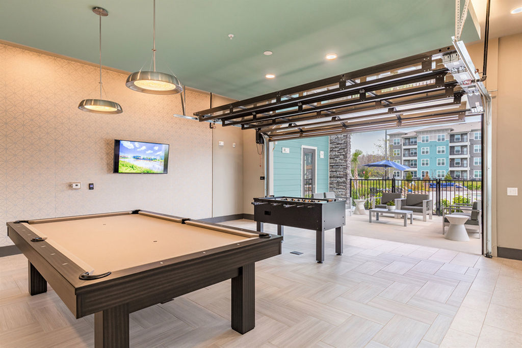San Mateo Apartments Kissimmee Florida gaming lounge with pool table and foosball table