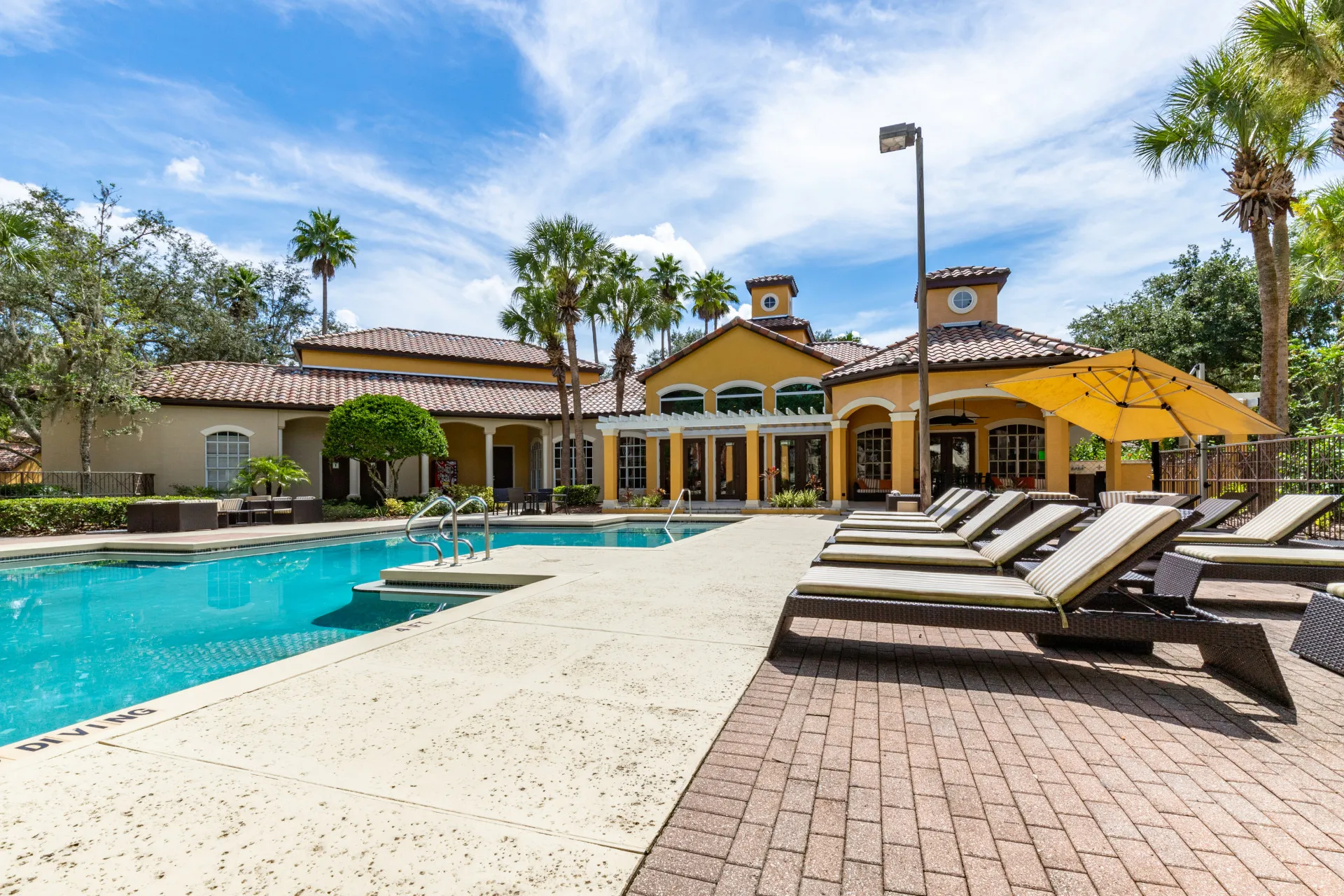 Mezzo of Tampa Palms Swimming Pool with Clubhouse in the Background