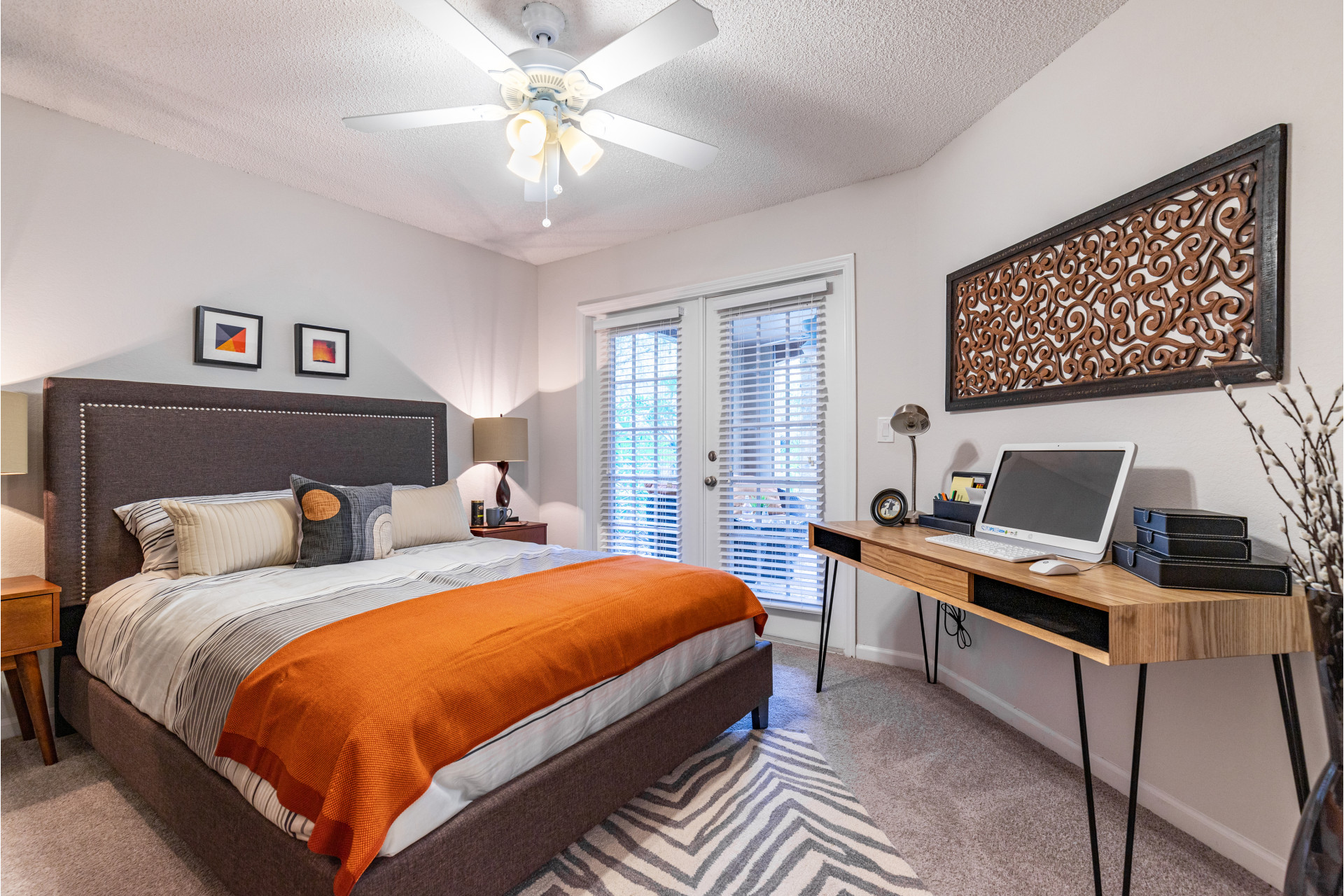 Mezzo of Tampa Palms Model Apartment Primary Bedroom with Furnishings