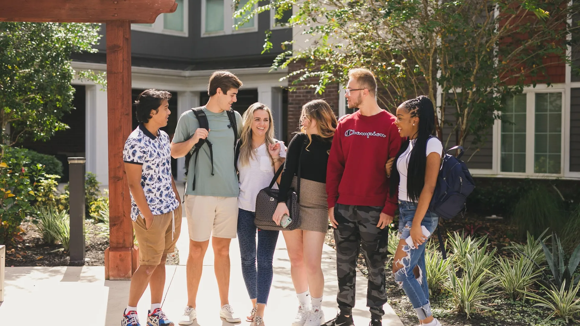 TAMUK students relaxing and chatting at their Kingsville student housing