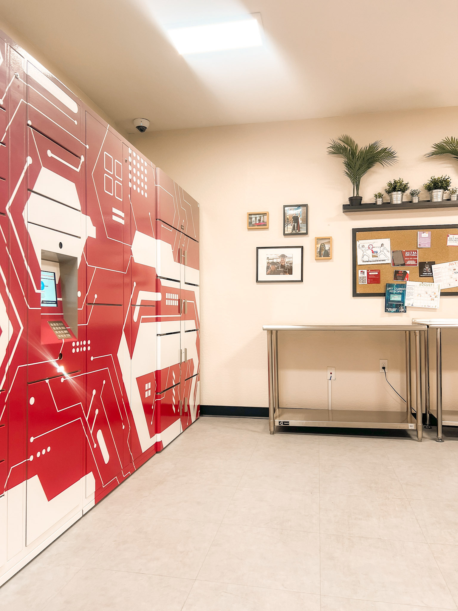 Contemporary mailroom with vibrant red parcel lockers and a modern, inviting decor.