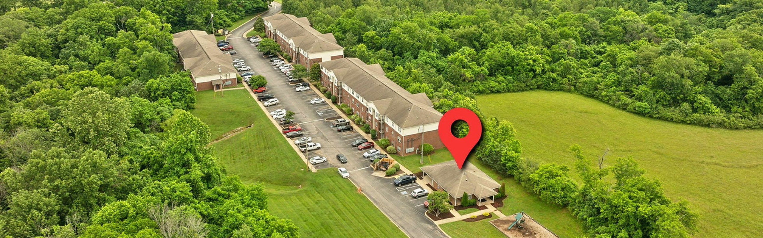 Charming apartment complex nestled in lush greenery featuring expansive views and a serene atmosphere. Highlighted with convenient parking and proximity to nature, ideal for a tranquil lifestyle.