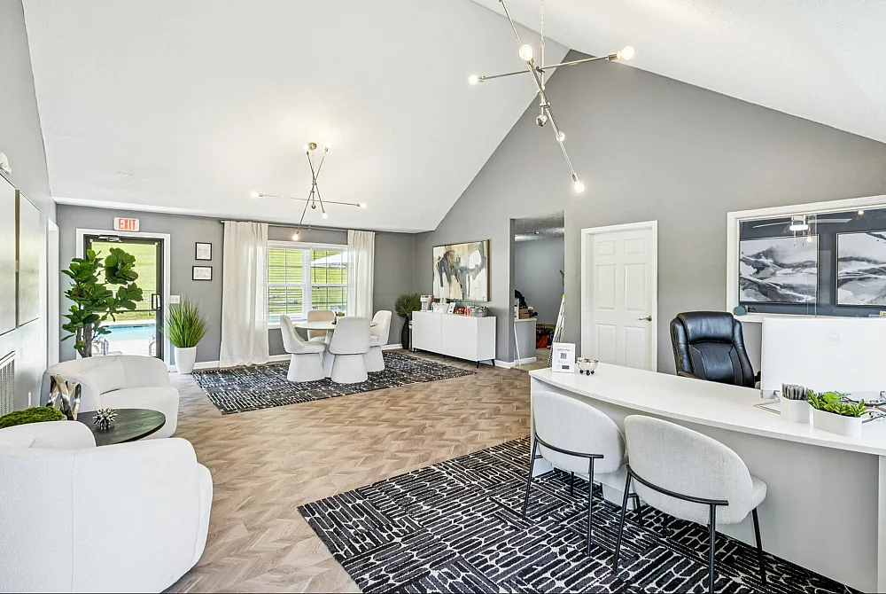 Elegant office space with modern decor, featuring chic lighting, stylish furniture, and abundant natural light.