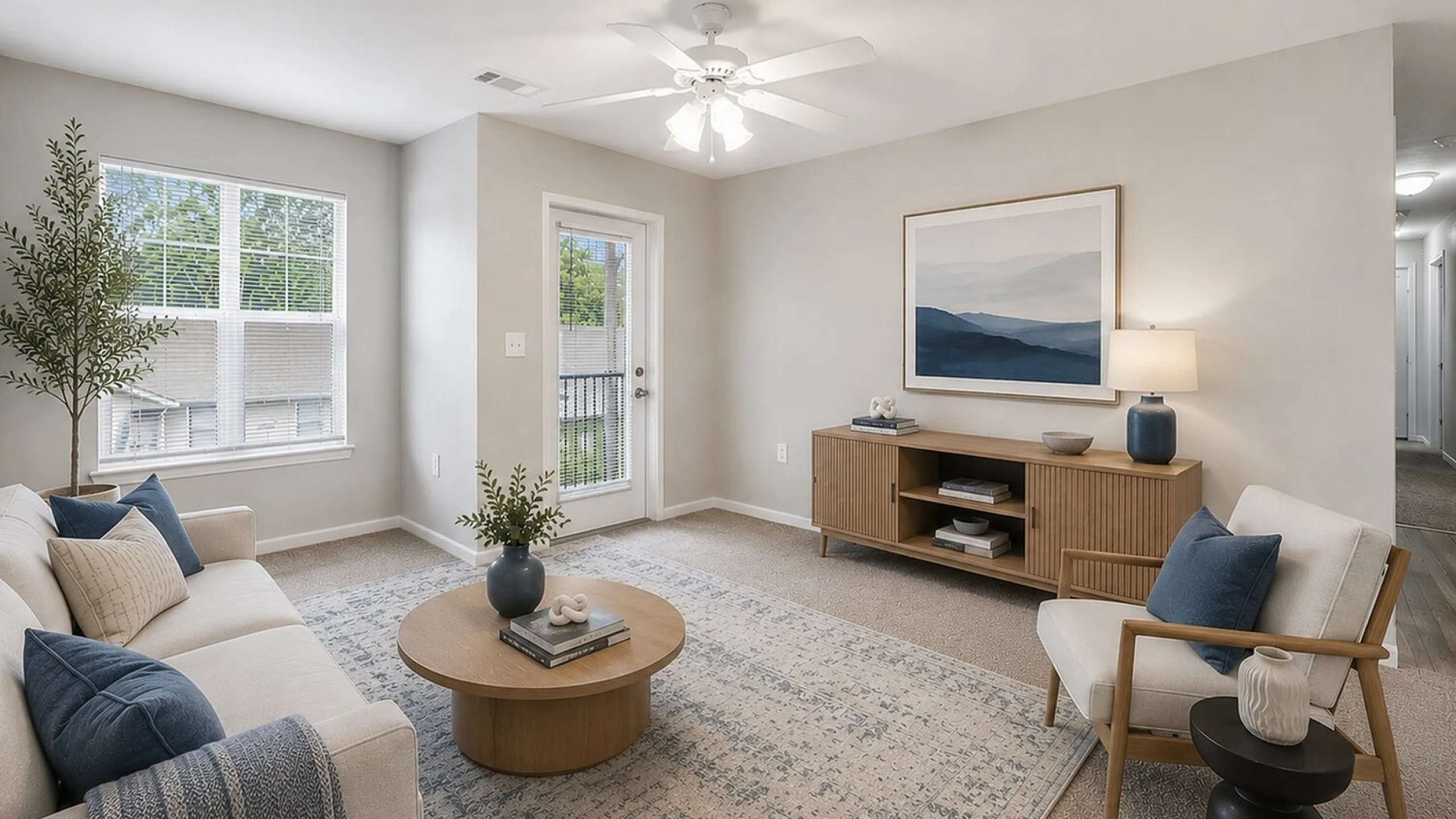 Bright and inviting living room with elegant decor, featuring a cozy sectional sofa, stylish coffee table, and large windows offering natural light.