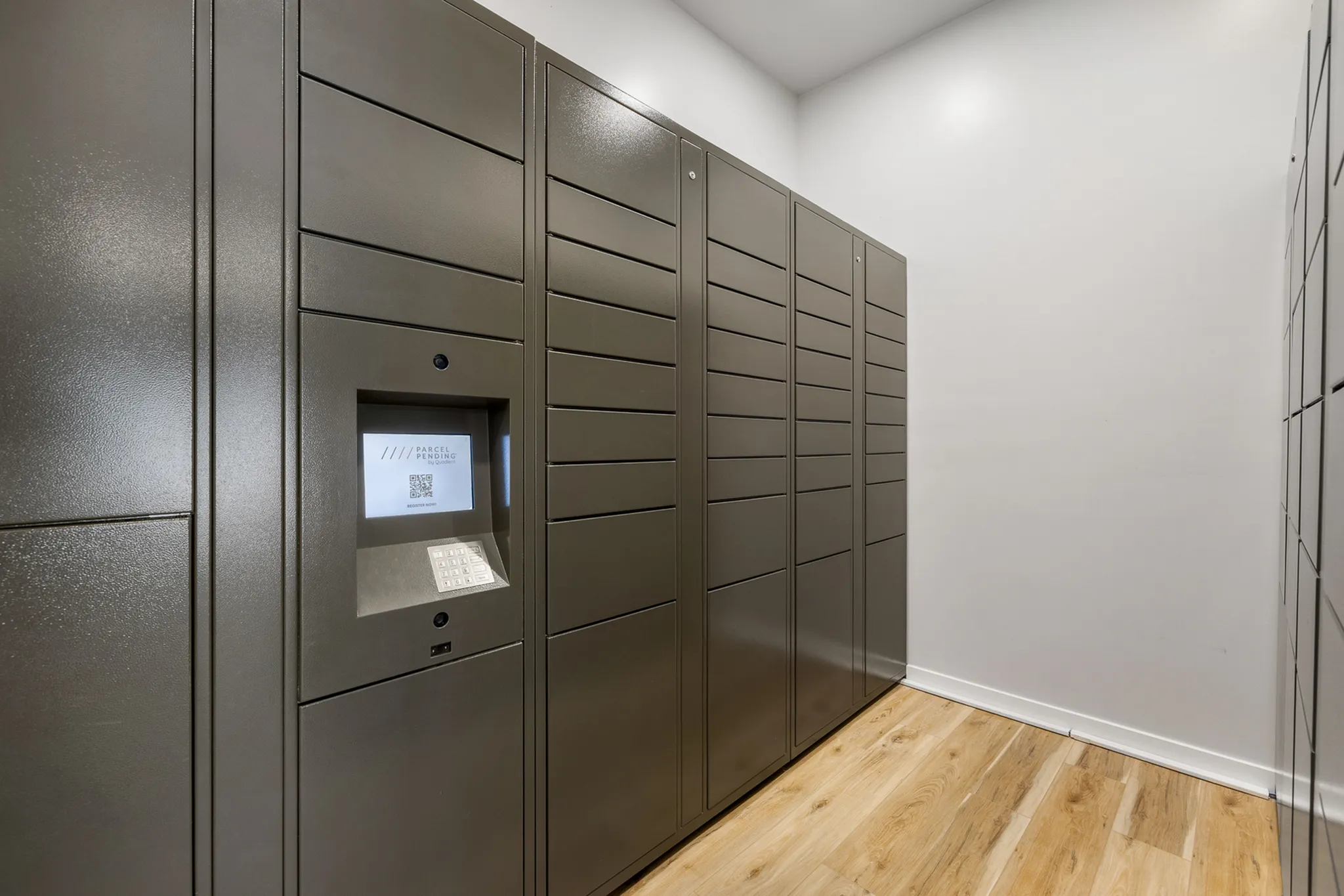 Modern apartment parcel locker room with sleek metallic design and advanced security features.