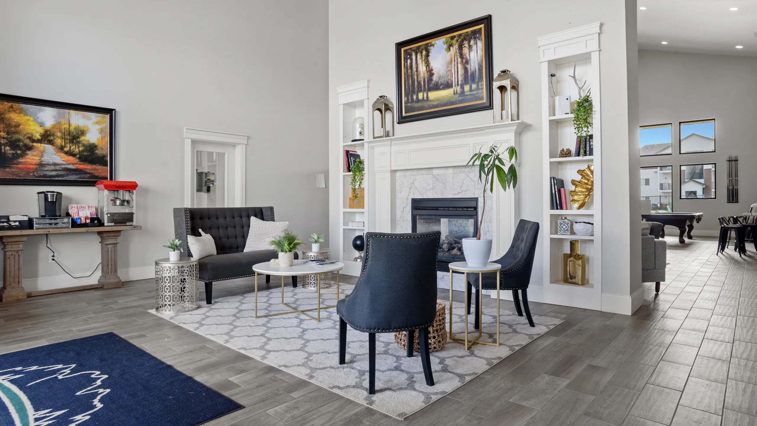 Elegant modern living room featuring a sophisticated color palette, plush seating, and a cozy fireplace, perfect for relaxation and gatherings.