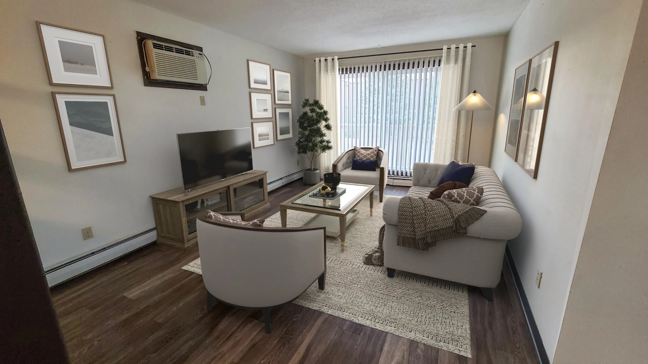 Cozy and inviting living room with a stylish sofa, chic armchair, modern coffee table, and large window allowing ample natural light.
