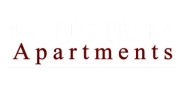 Elegant Walnut Creek Apartments logo with bold serif font and deep maroon accents.