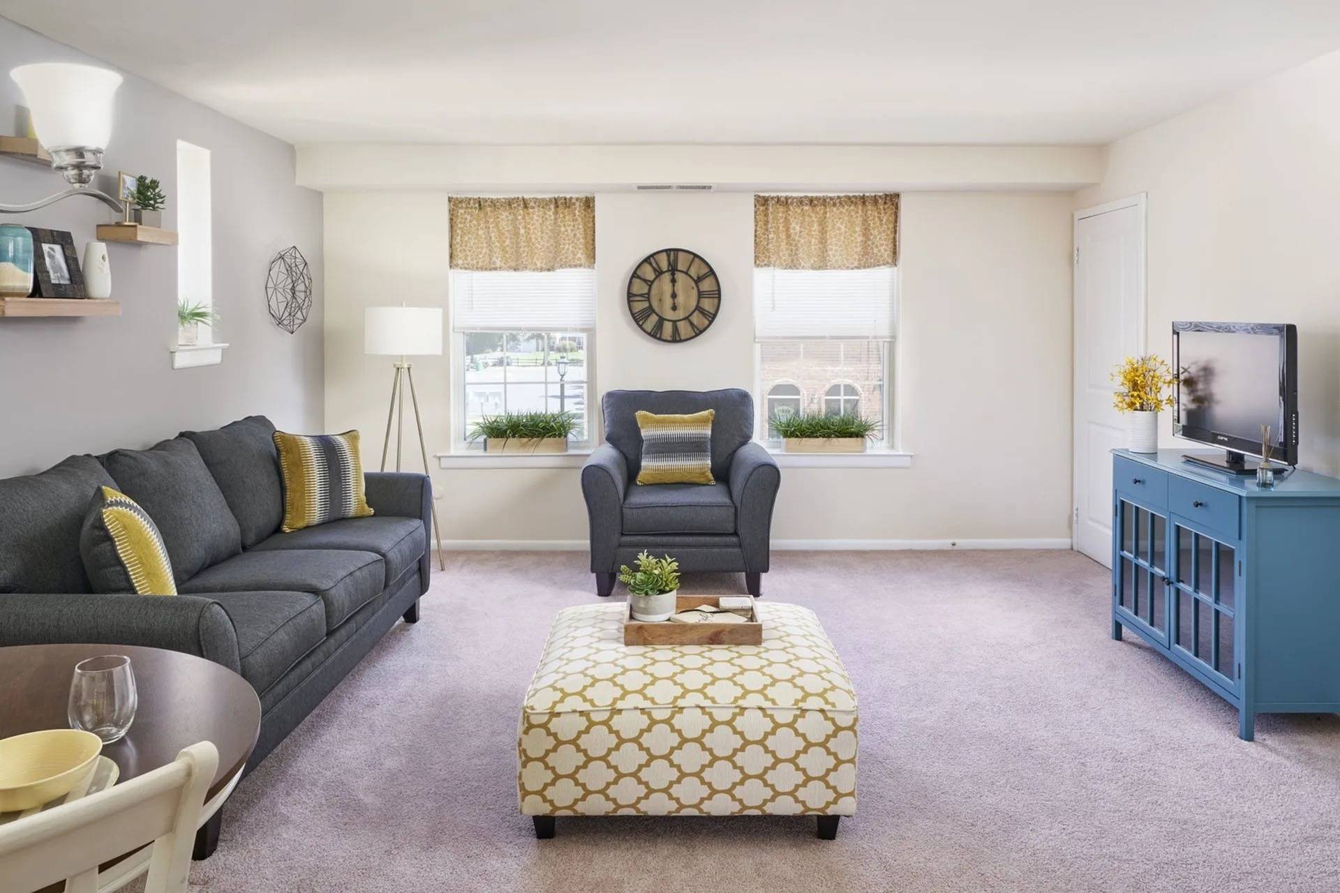 Pet Friendly Apartments in Bensalem PA - Village Square - A Bright And Spacious Living Room With Plush Carpeting, Multiple Windows, And An Accent Wall
