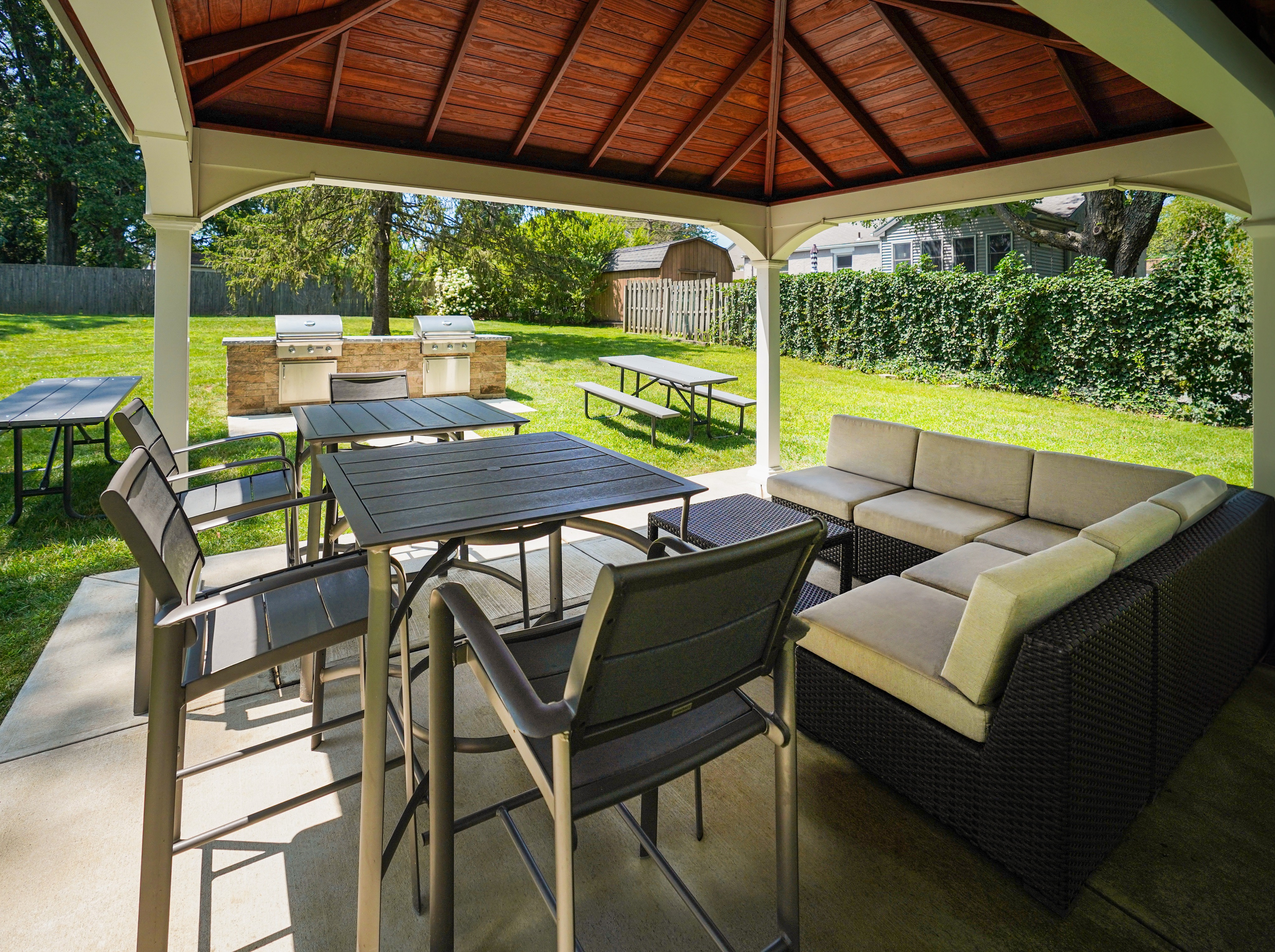 Apartments For Rent In West Chester - The Grilling Area Has Two BBQ Stations, Benches, Couches, Tables, Gazebo, And Is Surrounded By Maintained Lush Grass.