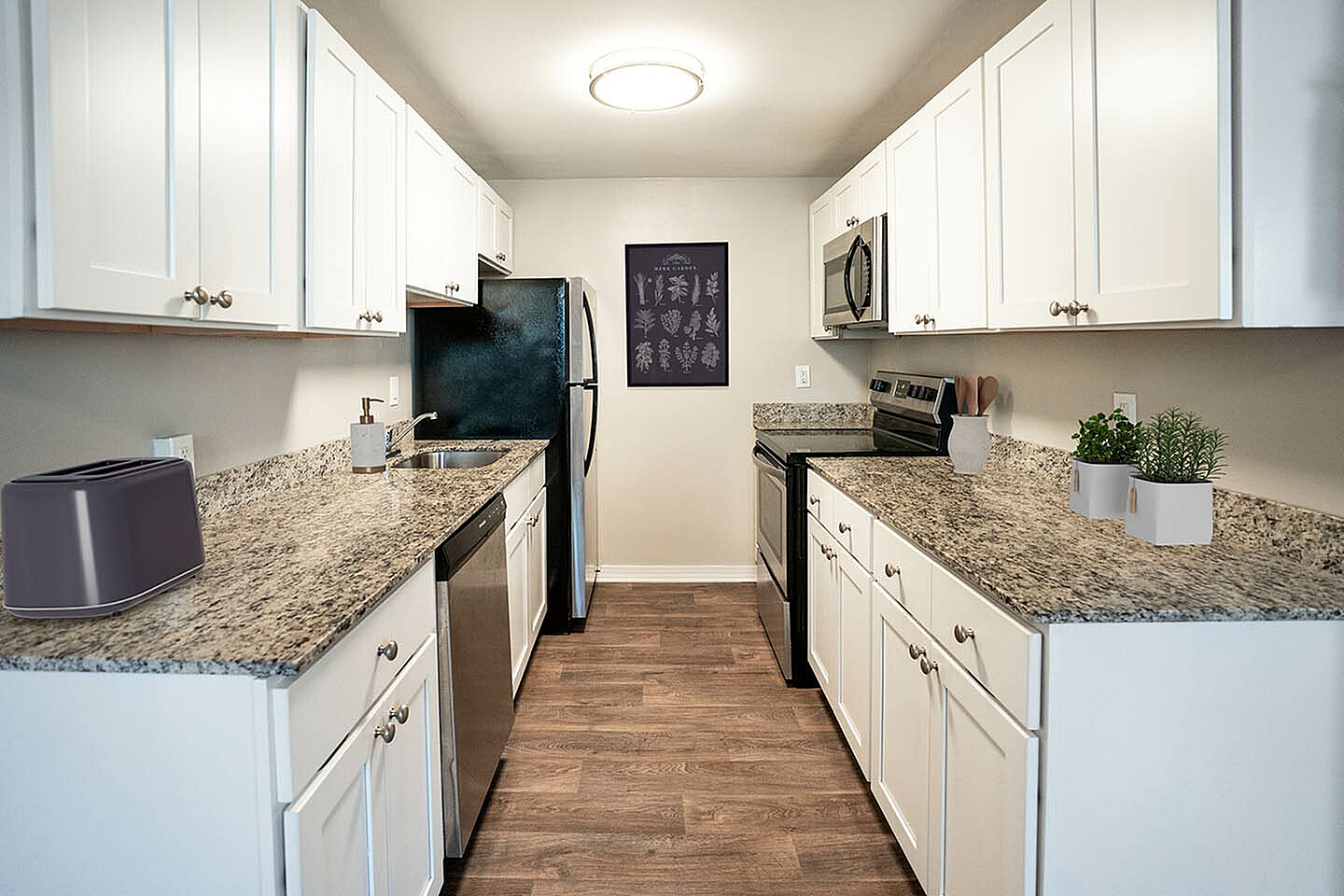 Modern kitchen with sleek granite countertops, stainless steel appliances, and ample cabinet space for a stylish cooking experience.