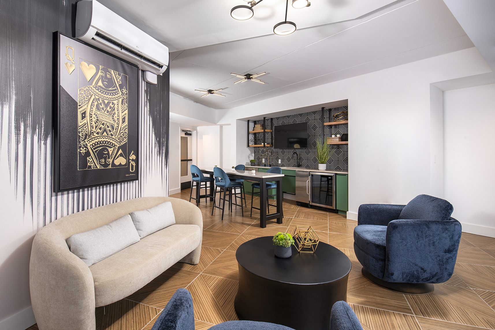 Contemporary apartment interior with elegant open layout, featuring a chic lounge area, stylish dining space, and modern kitchen with geometric backsplash.