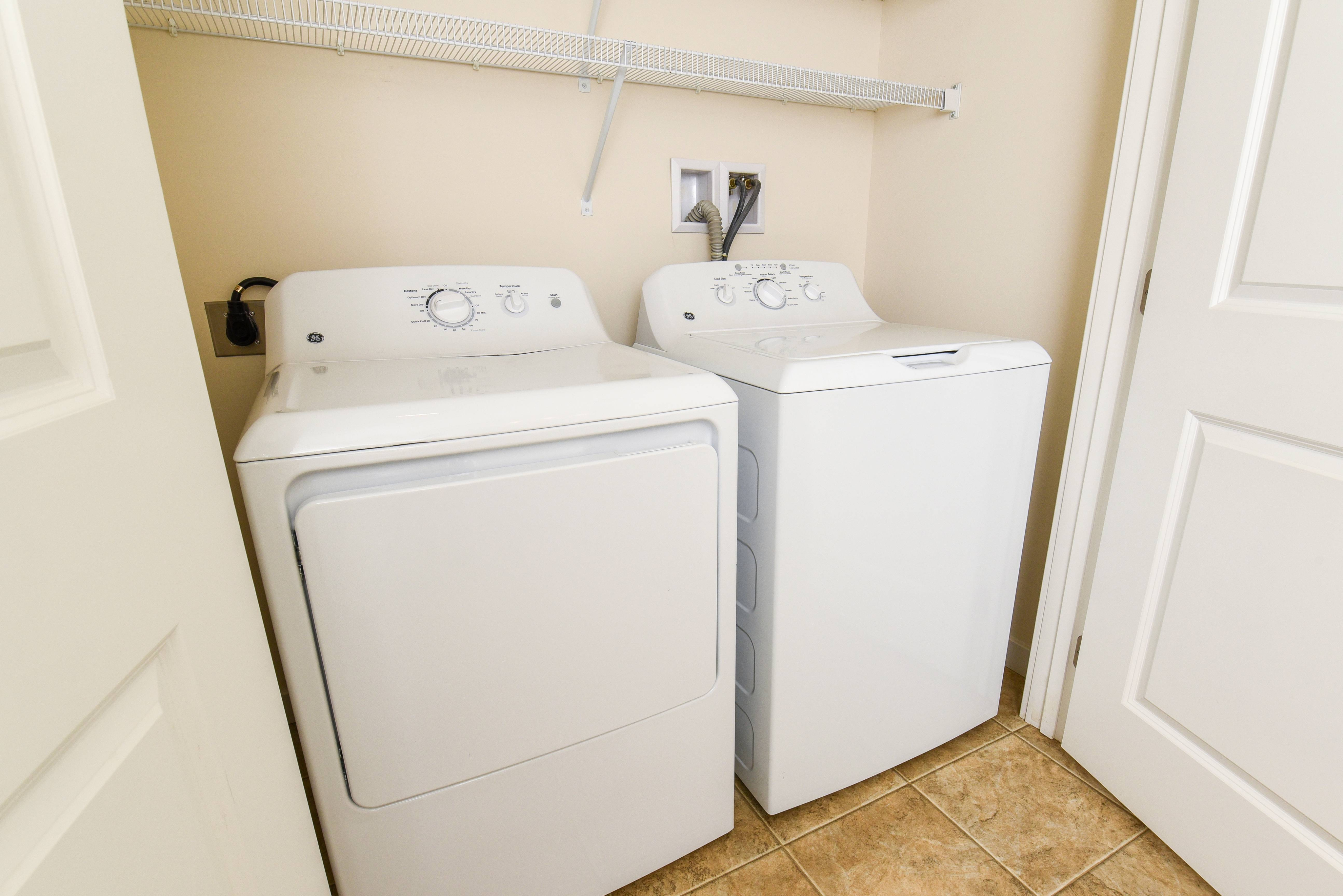 Bright and efficient laundry room with modern washer and dryer set, perfect for convenient living.