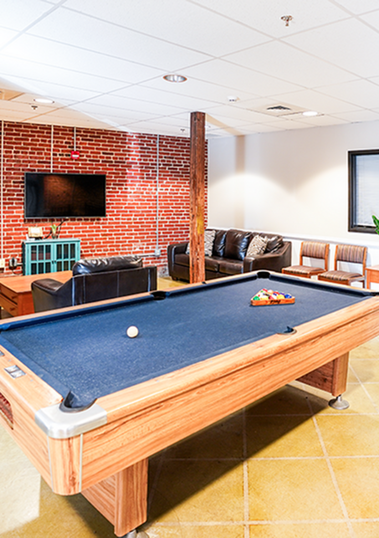 Community room with seating, tv and pool table