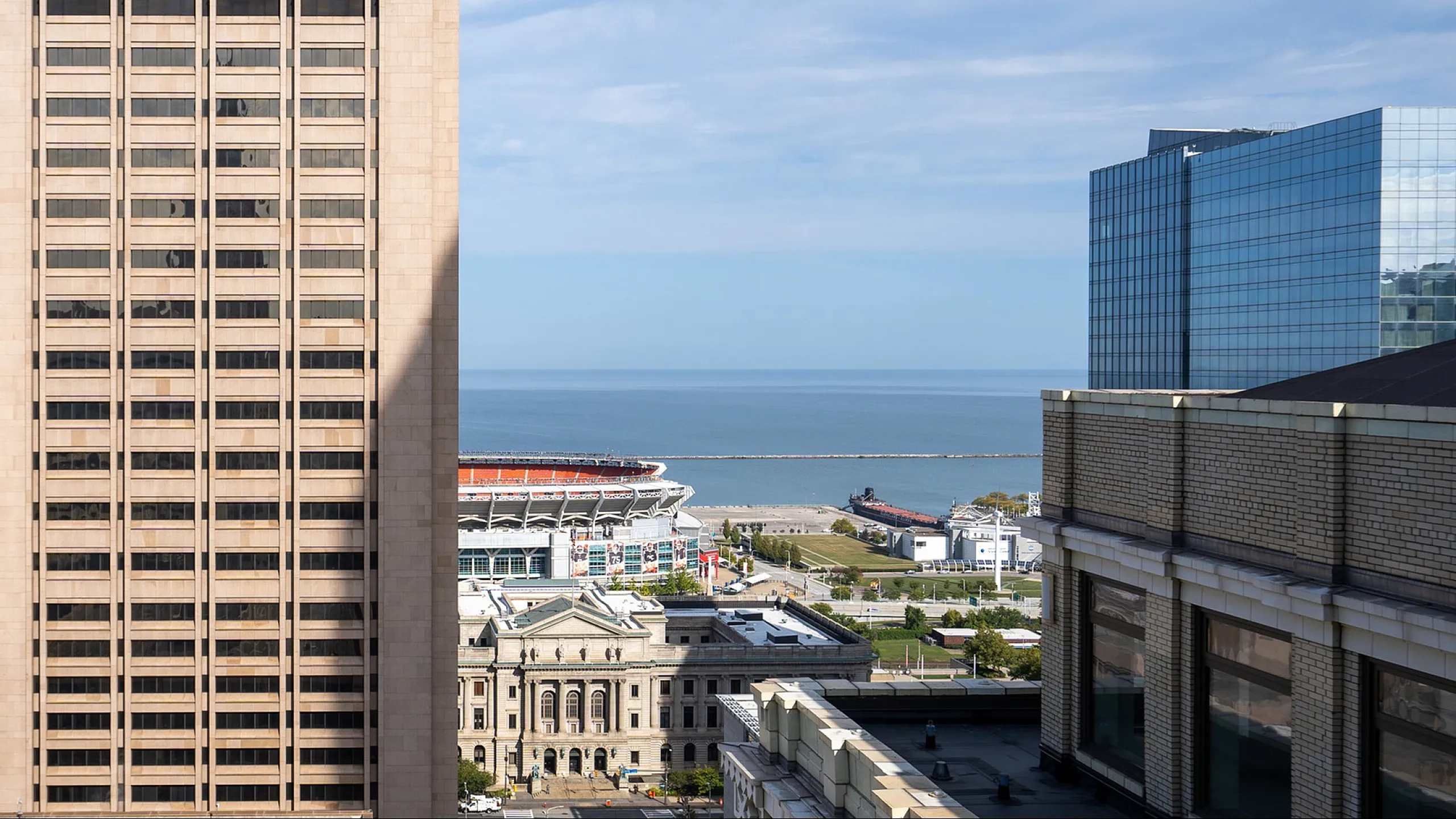 Scenic urban view with office buildings and a stunning water backdrop.