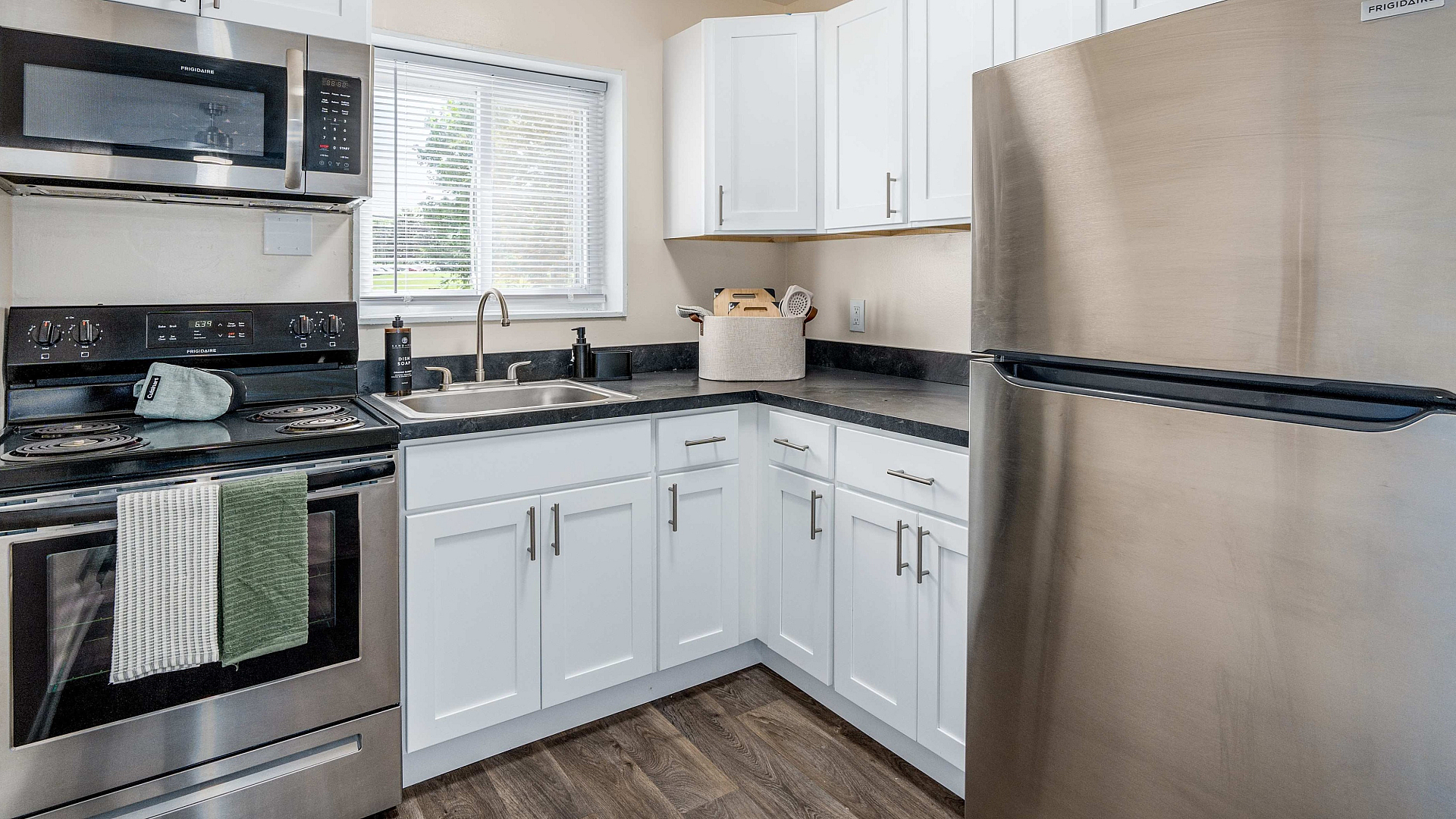 Elegant kitchen with sleek stainless-steel appliances, modern cabinetry, and bright natural lighting.