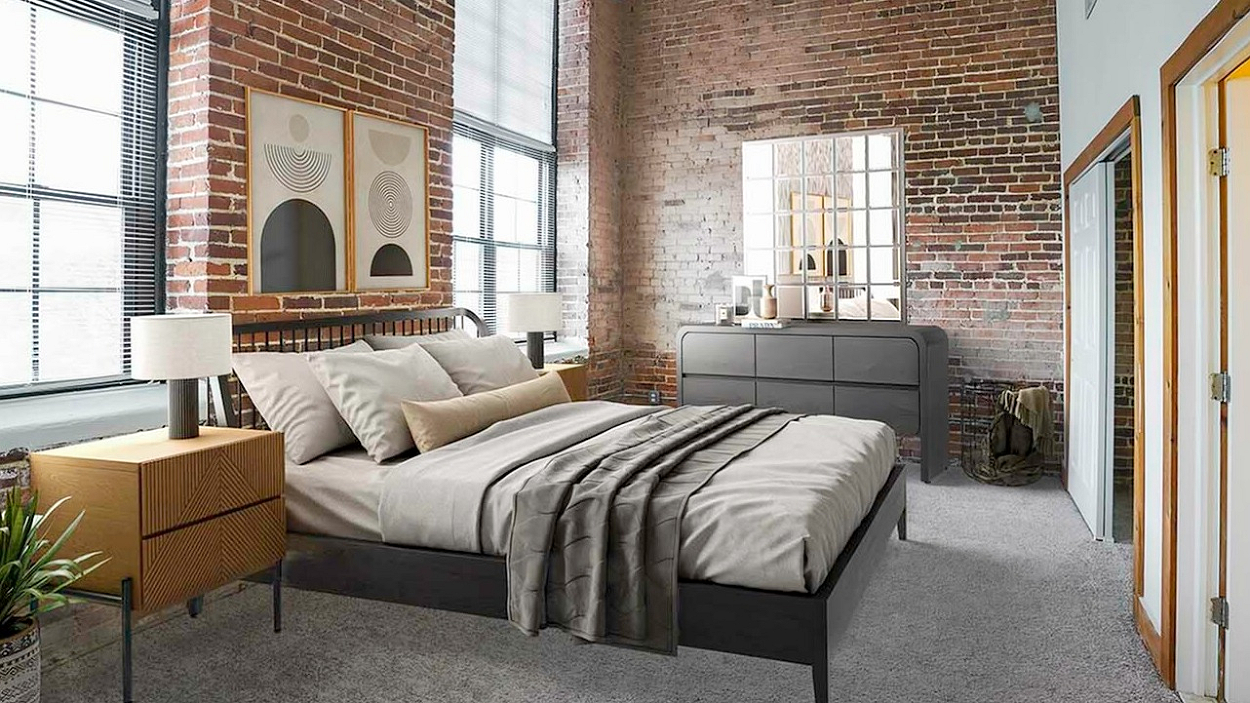 Chic bedroom with industrial charm featuring exposed brick walls, large windows, and stylish modern furnishings.