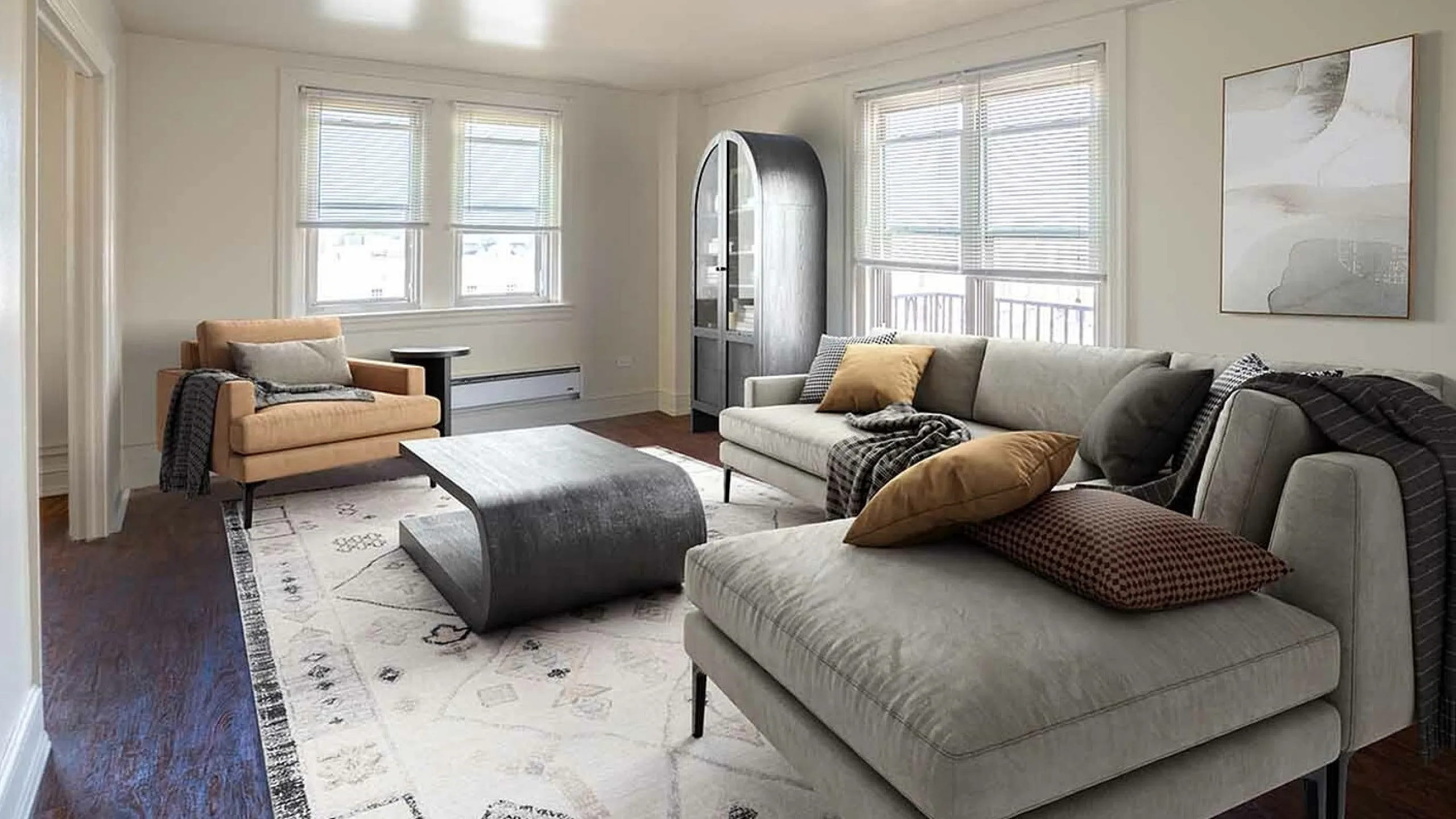 Elegant living room with contemporary furniture, featuring a plush gray sofa, stylish coffee table, and abundant natural light from large windows.