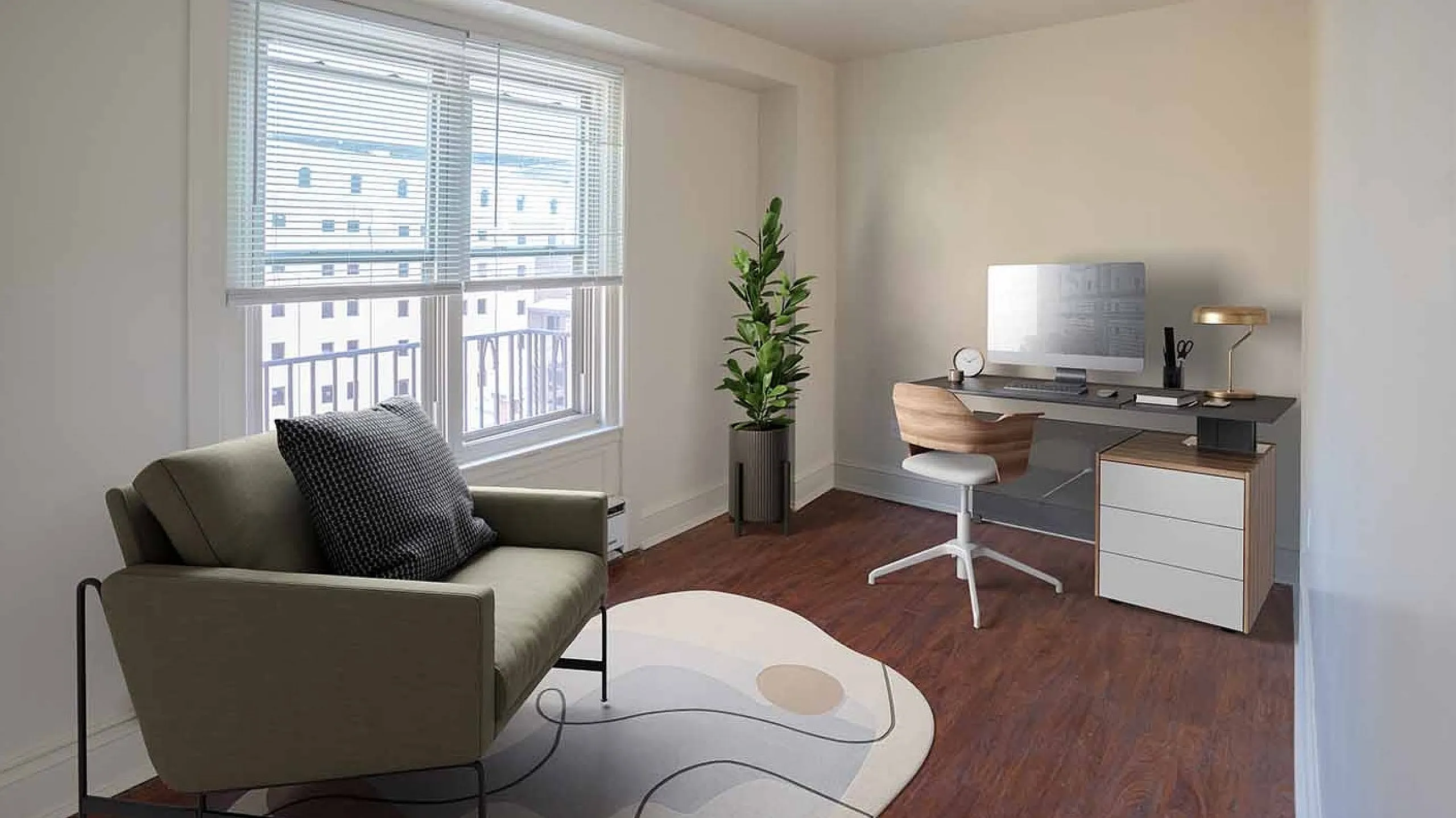 Bright home office with large window, cozy seating, stylish desk, and lush plant accent.