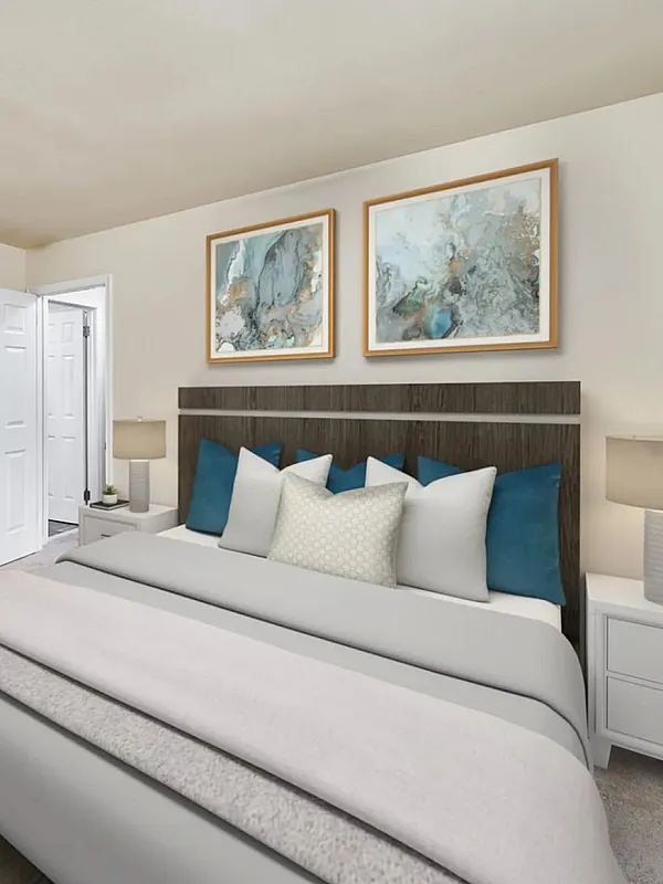 Elegant bedroom with cozy bed, artistic wall decor, and convenient in-room laundry, perfect for modern living.