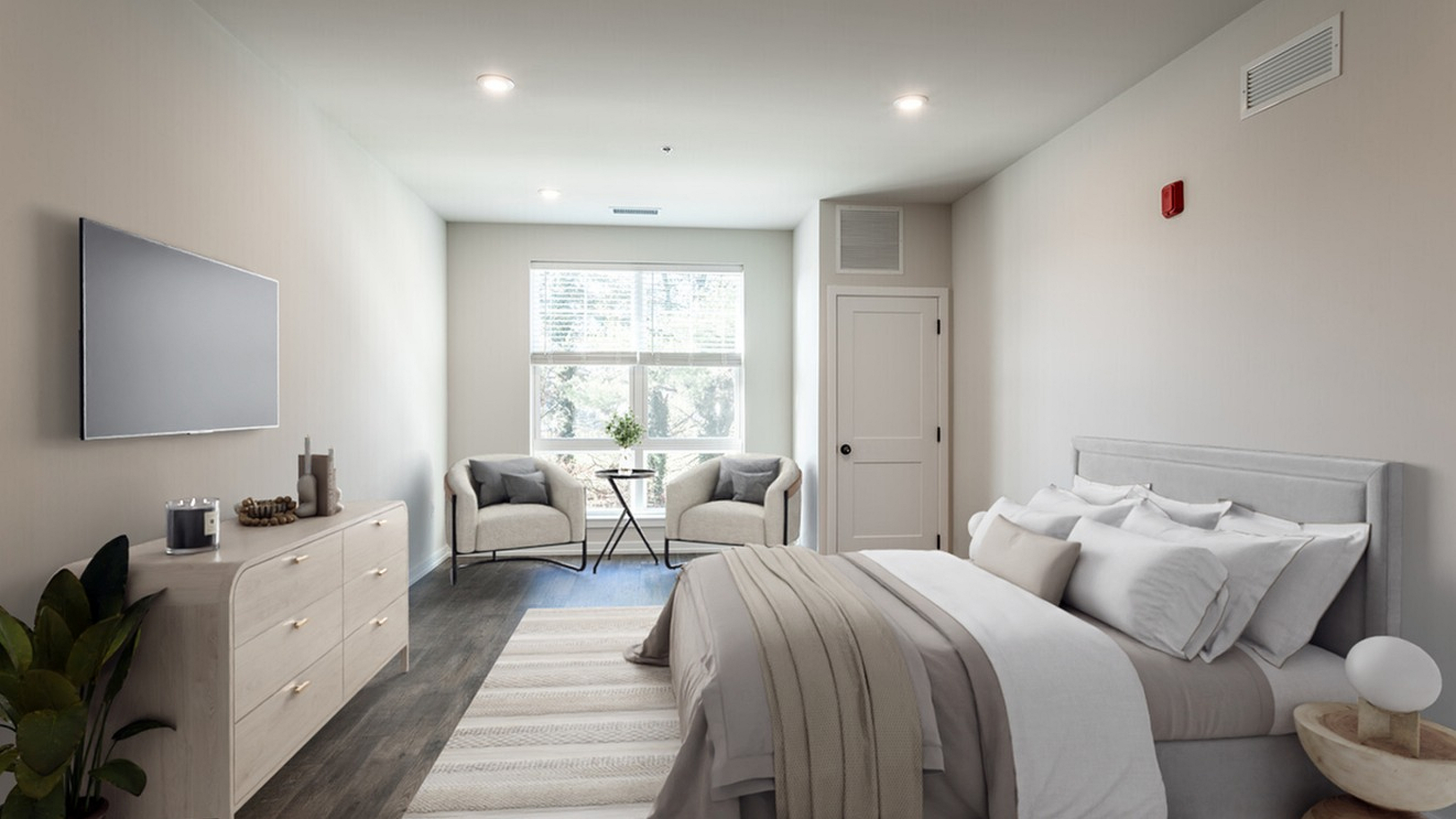 Elegant bedroom with natural light, featuring a cozy bed, stylish dresser, and inviting seating area by the window.