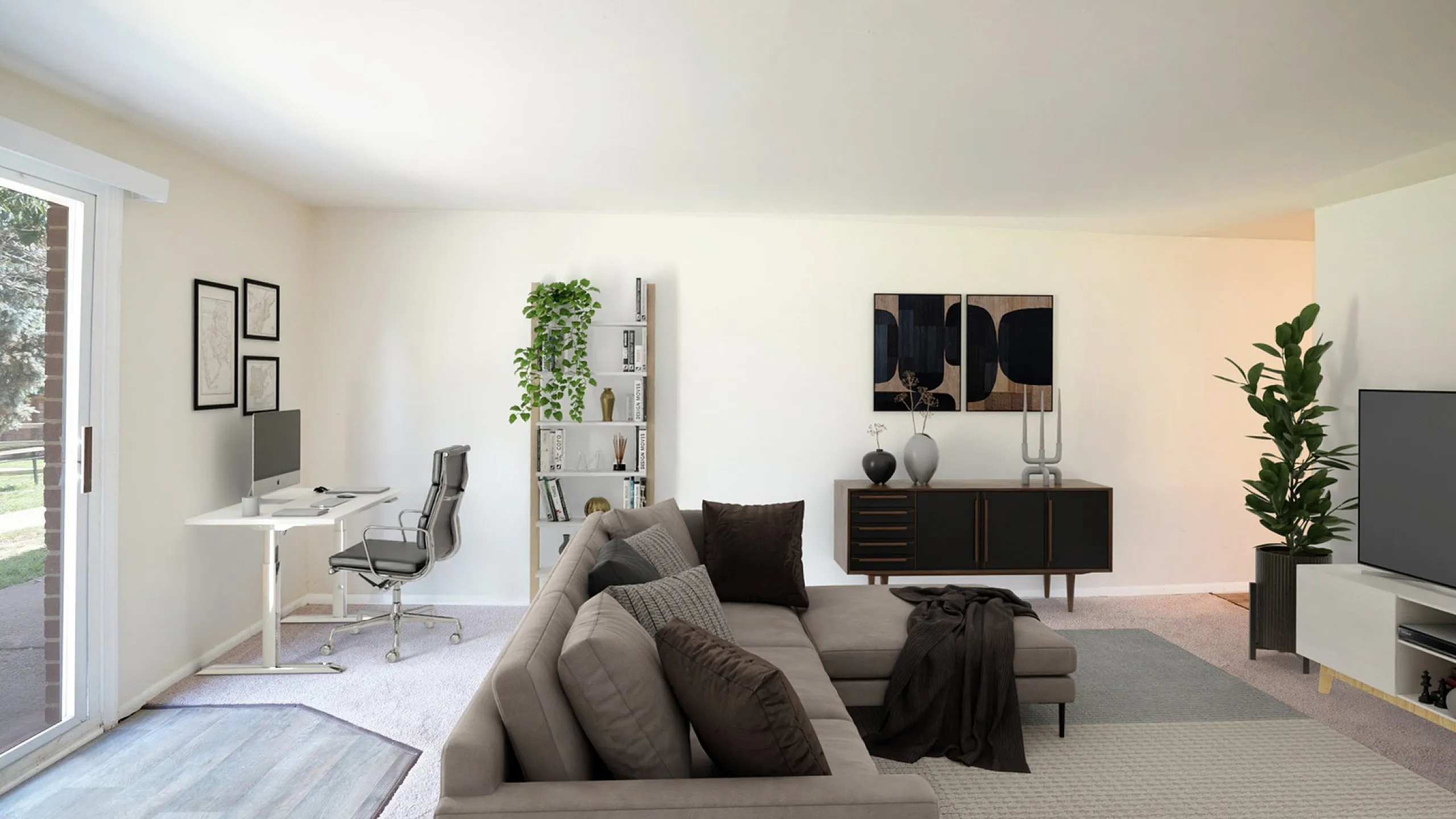 Bright and spacious living room with cozy sectional sofa, elegant decor, and a modern home office setup by large sliding glass doors.