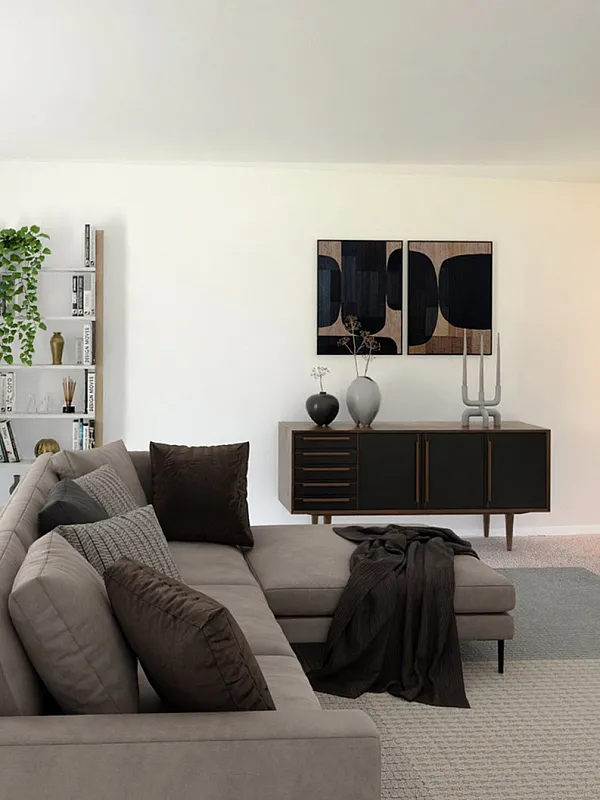 Bright and modern living space featuring a stylish sectional sofa, elegant home office corner, and vibrant green plants for a fresh ambiance.
