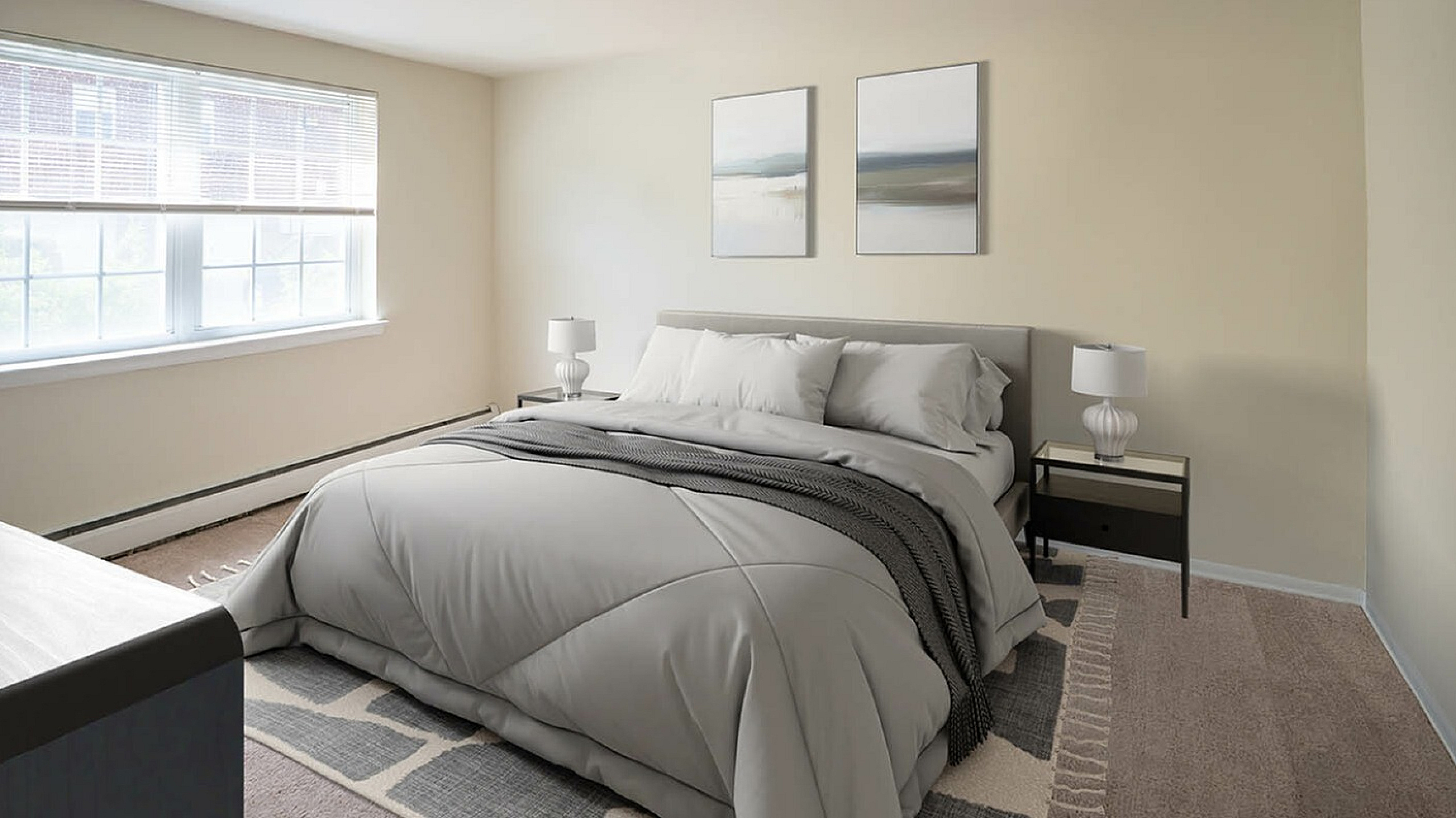 Inviting bedroom with cozy queen-size bed, large sunlit window, modern decor, and soothing neutral tones.