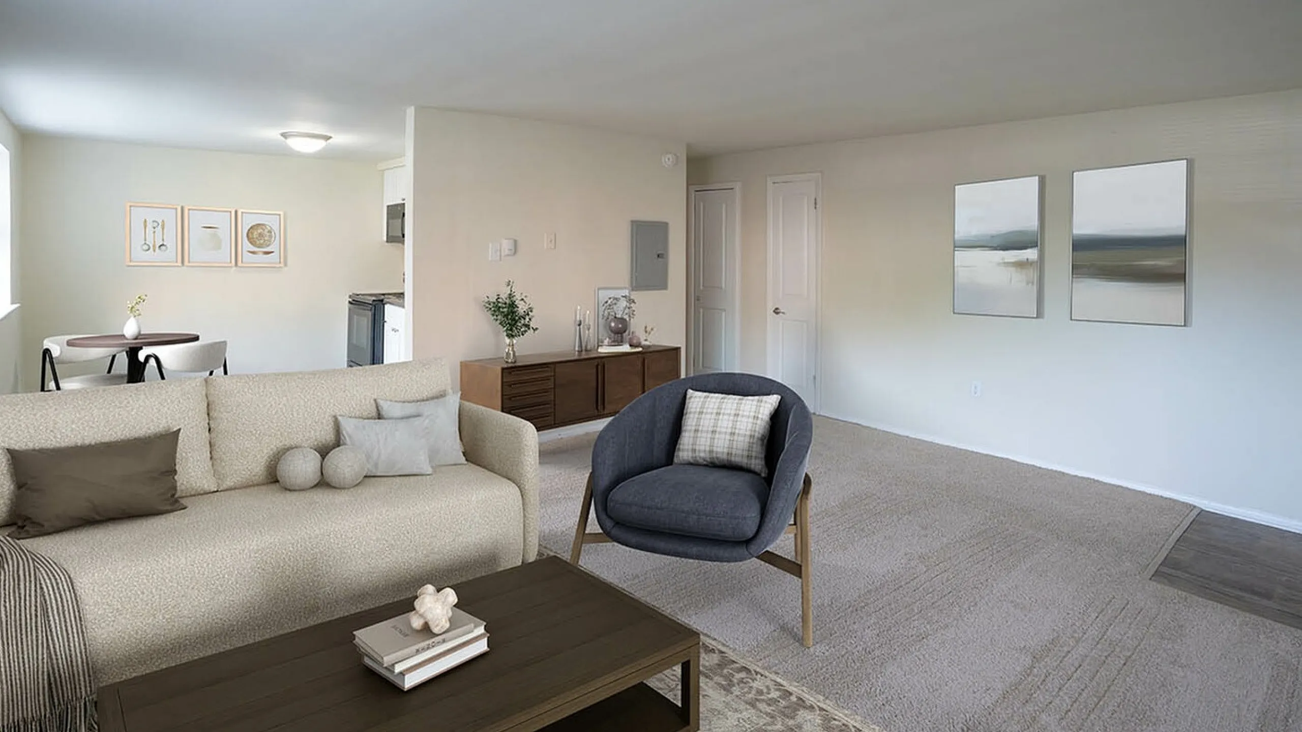 Inviting open-plan living room with plush carpeting, cozy seating, and modern decor leading into a stylish dining area.