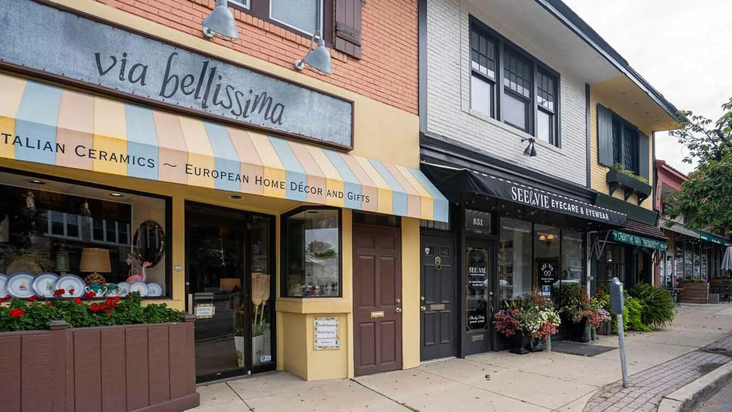 Charming European-themed street with a vibrant Italian ceramics shop and eye-catching storefronts.