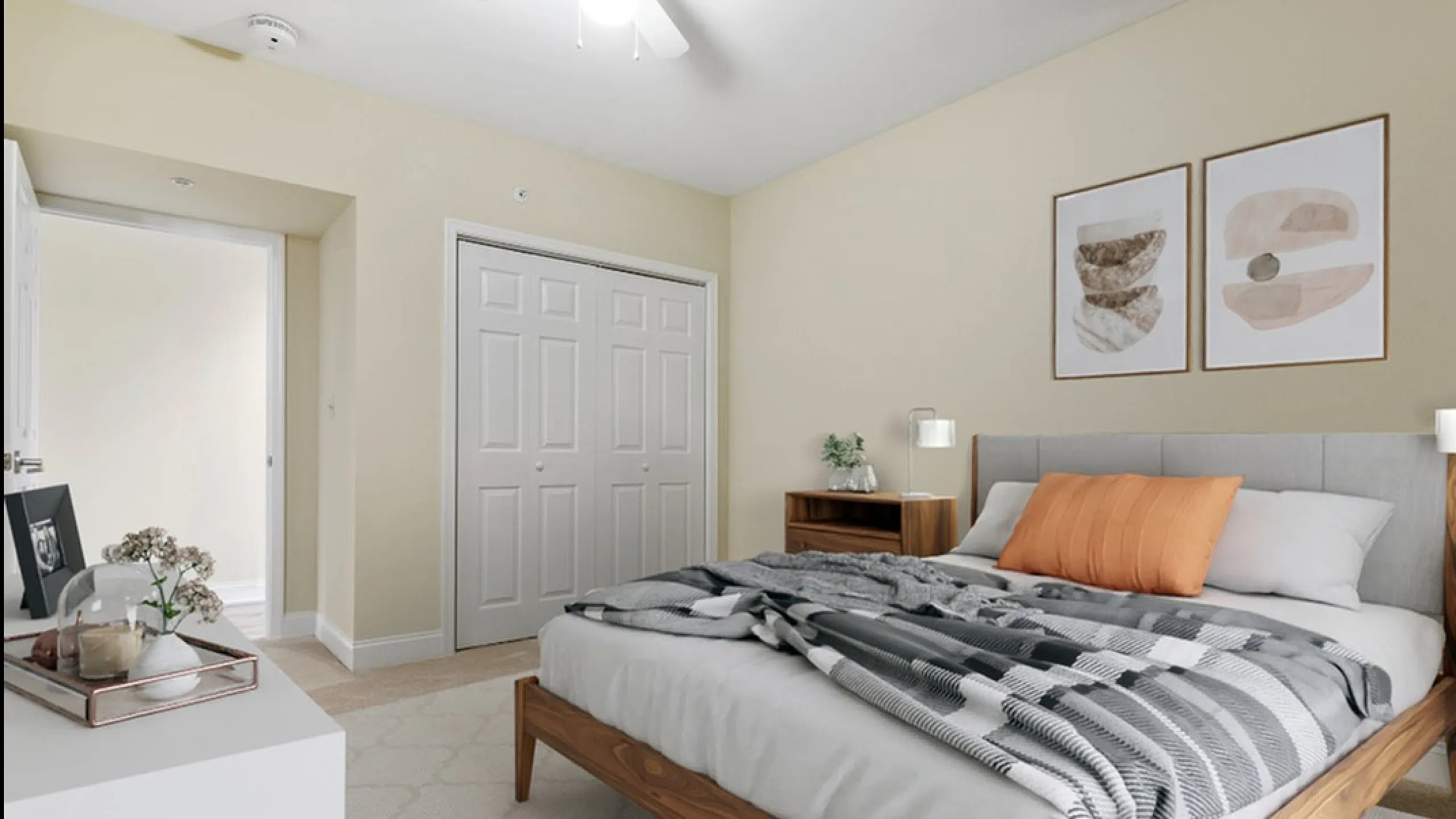 Inviting bedroom with cozy double bed, neutral tones, stylish artwork, and ample natural light.