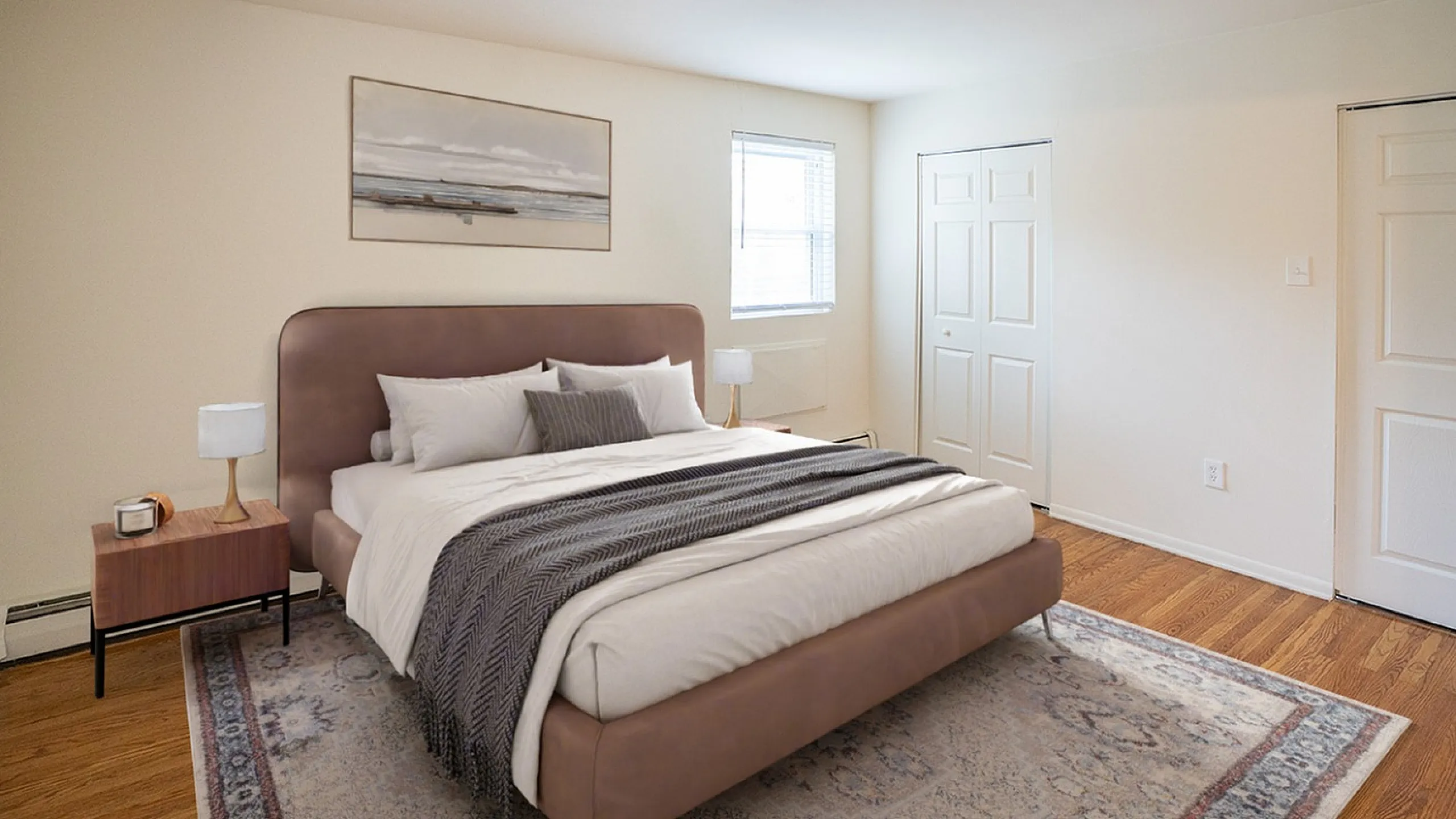 Inviting bedroom with a plush bed, elegant side tables, and a cozy atmosphere, perfect for relaxation.
