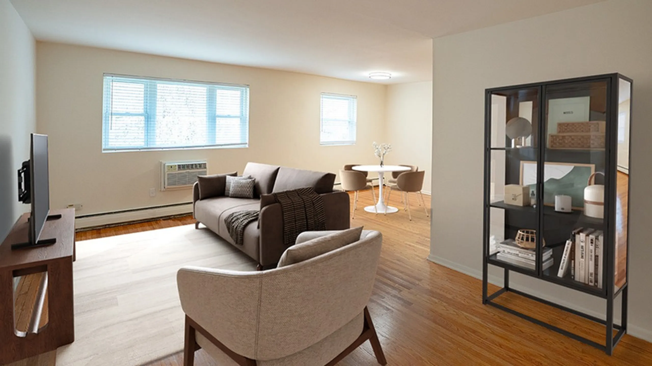 Inviting open-concept living space featuring cozy seating, elegant dining area, and abundant natural light.