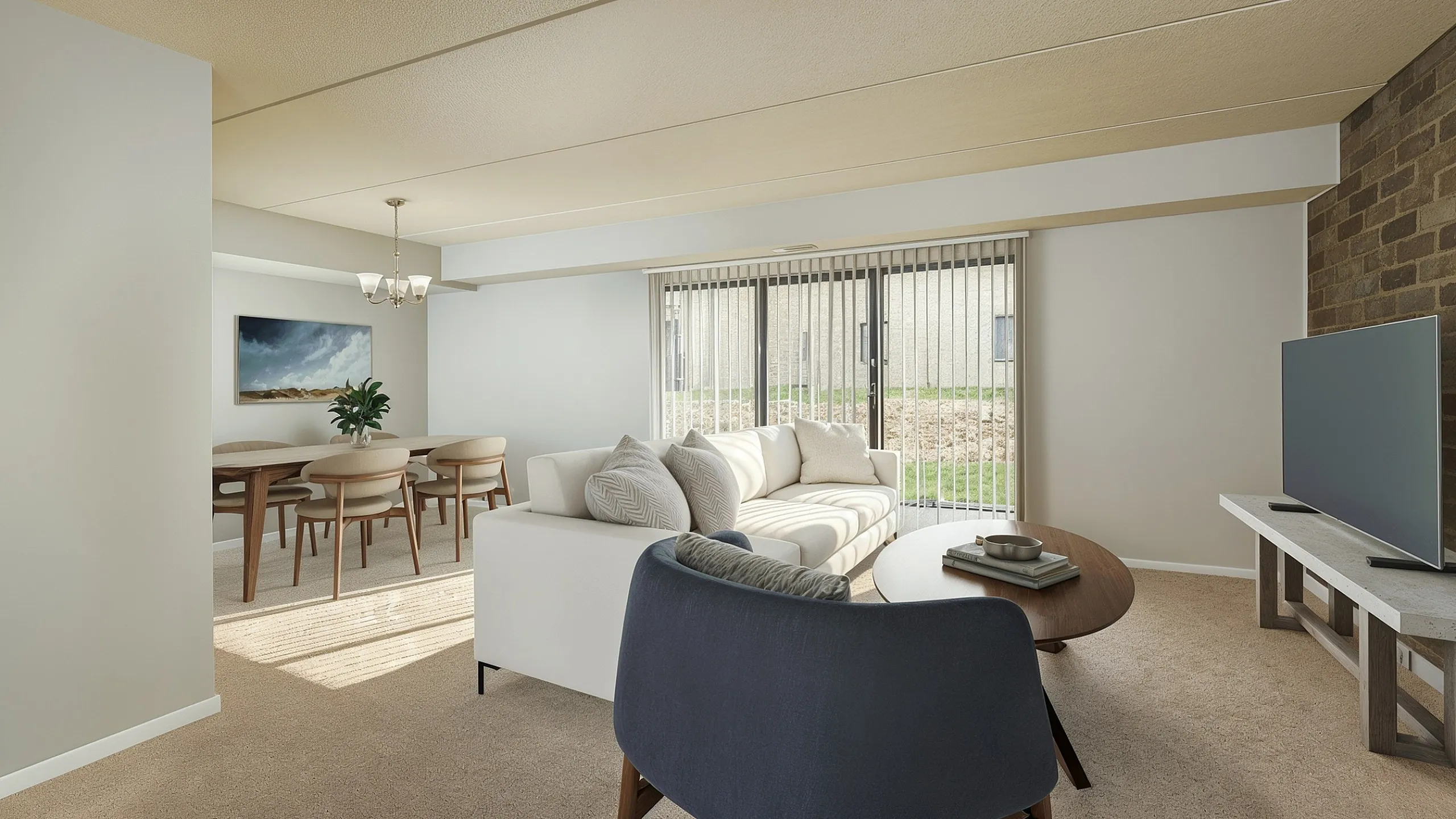 Bright and inviting living room featuring a modern sofa, stylish dining area, and large glass doors opening to a lush outdoor view.