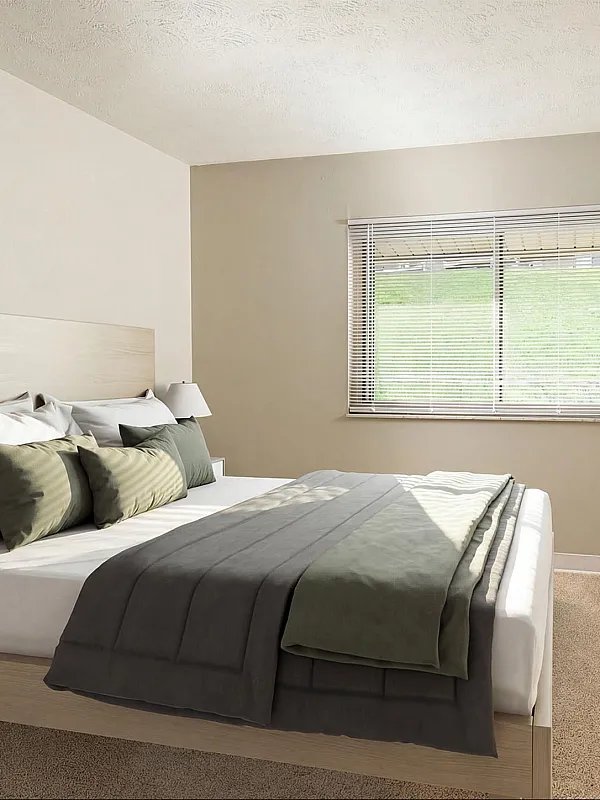 Inviting bedroom with a plush bed, elegant decor, and large window offering serene outdoor views.