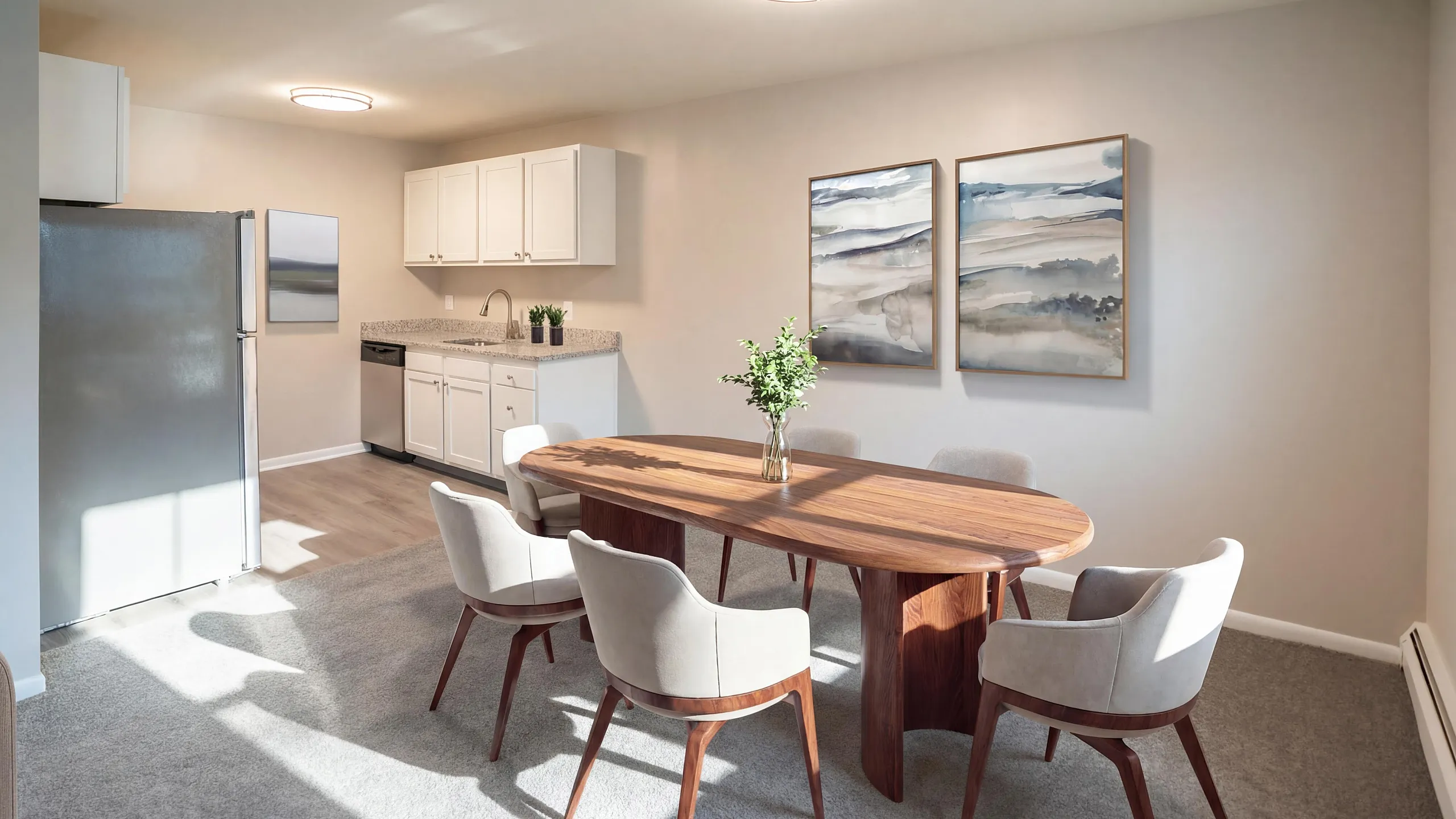 Chic dining area with elegant wooden table, plush chairs, modern kitchen, and stylish artwork in a bright, airy apartment setting.
