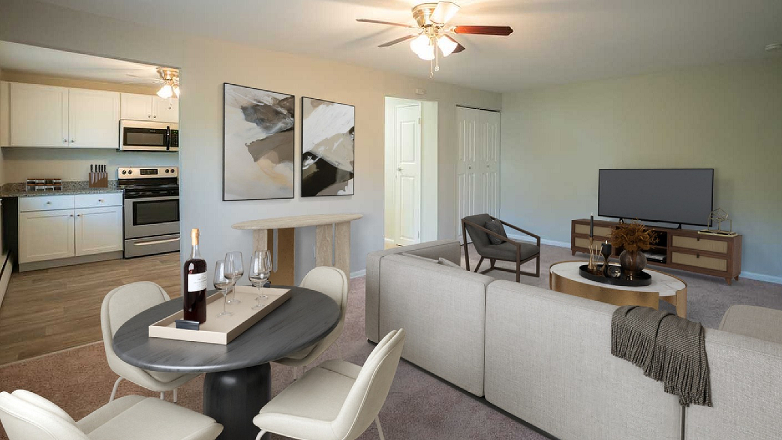 Chic open-concept living space featuring an elegant dining area and modern kitchen, perfect for entertaining.