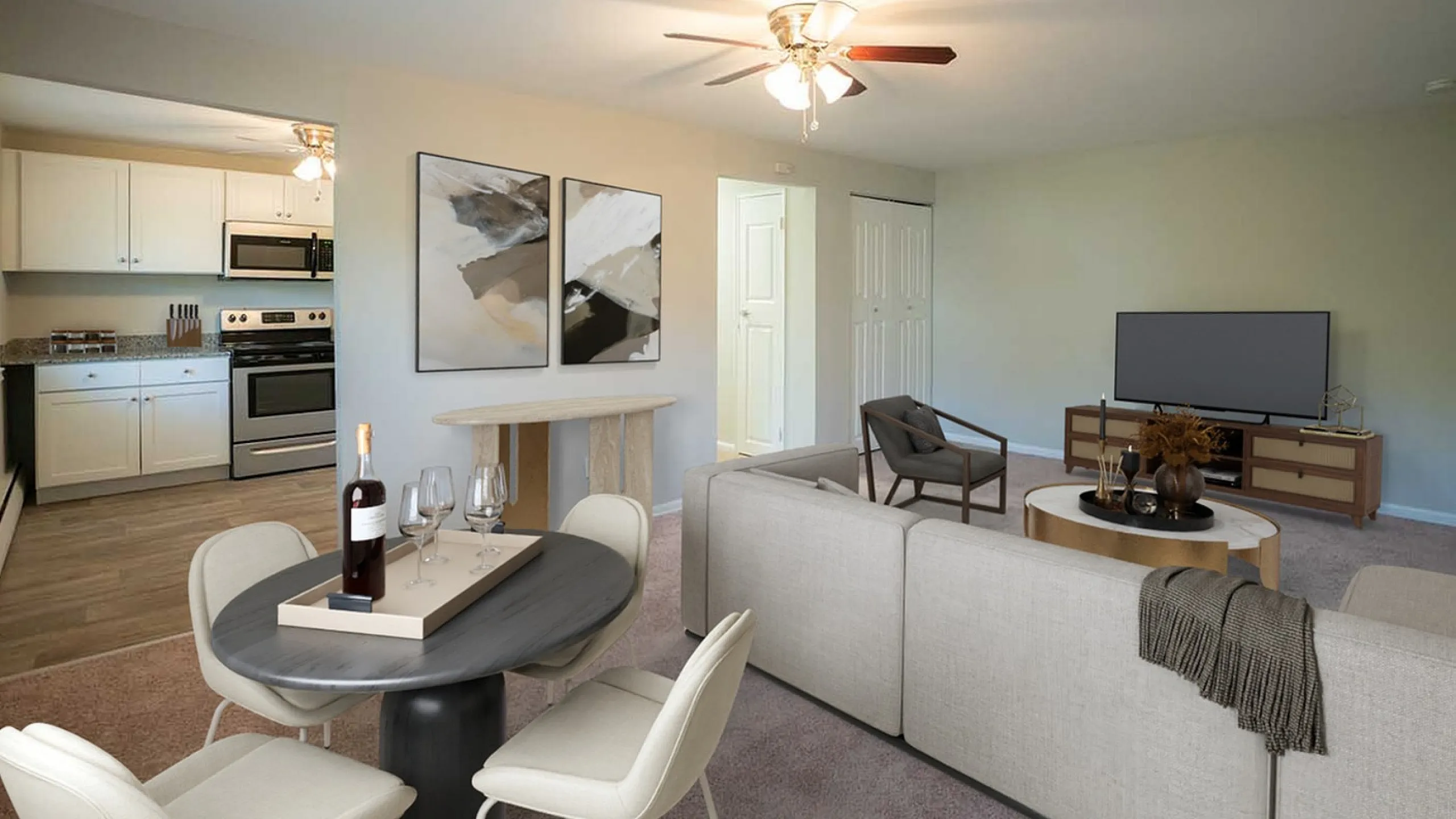 Inviting open-concept living space featuring a modern kitchen with stainless steel appliances, a chic dining area, and a cozy living room perfect for relaxation or entertaining.
