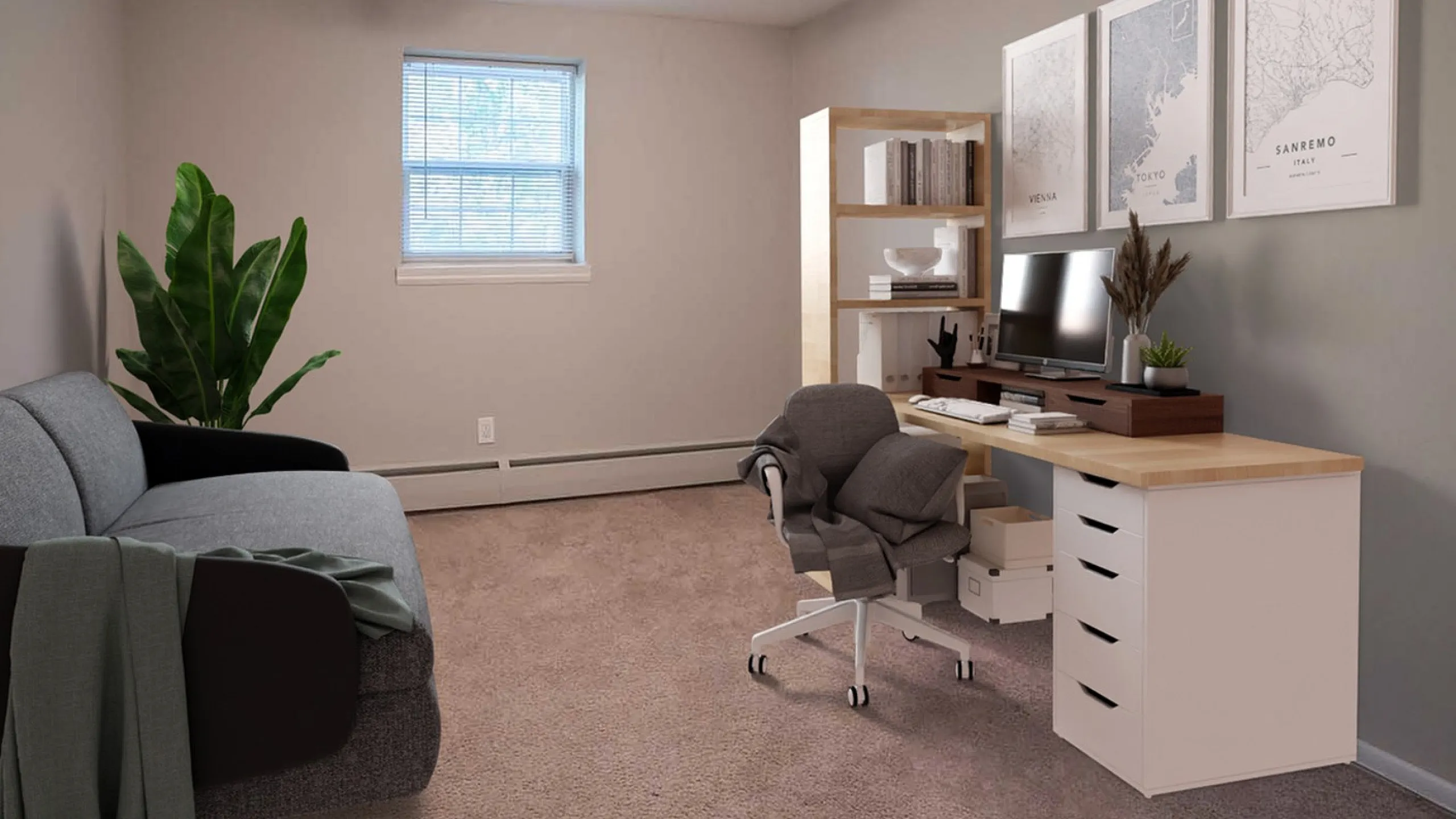 Inviting home office with a cozy grey sofa, modern desk setup, and elegant decor, perfect for productivity and relaxation.