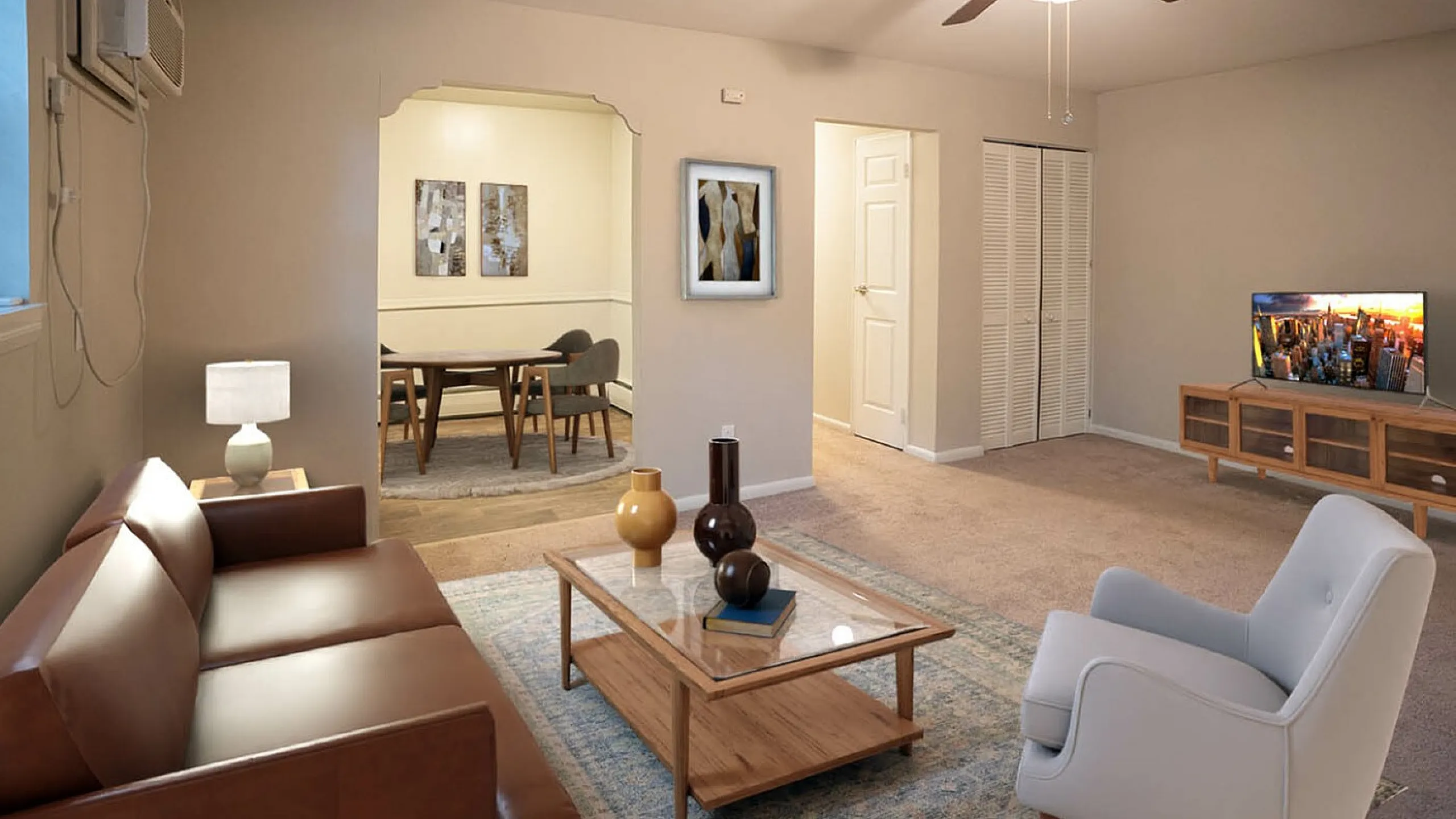 Cozy and inviting living room with modern decor, featuring a comfortable leather sofa, stylish armchair, and wooden coffee table adorned with decorative vases. A dining area is visible in the background, creating an ideal open-concept space