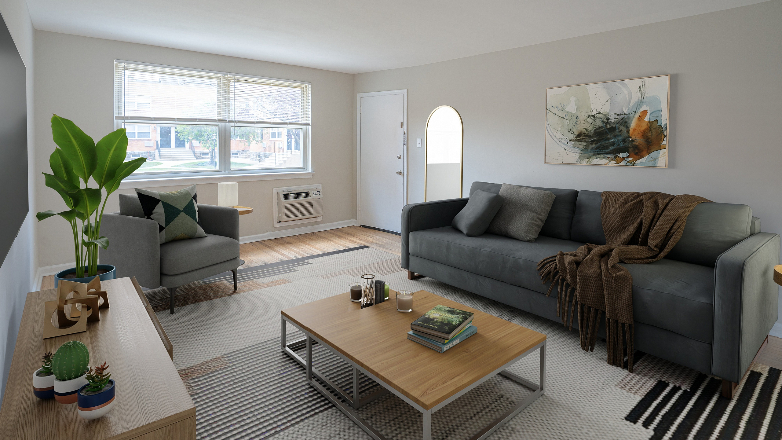 Bright and modern living room with stylish gray furniture, large window, and trendy decor.